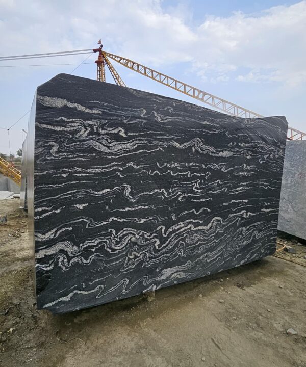 Product Overview: Reliance Titanium Black & Forest Black Granite is a luxurious natural stone celebrated for its striking black background enriched with flowing golden and white veins. Mined from our owned quarry, this granite represents strength, elegance, and timeless beauty — making it a preferred choice for high-end architectural and interior projects across the globe. Each block is a unique creation of nature, offering unmatched character and visual depth. Technical Specifications: Title Reliance Titanium Black & Forest Black Granite Block Stone Type Granite Block Type Gangsaw Block Block Size 300 CM x 180 CM x 180 CM (LXWXH) Color Deep Black with Gold & White Veins Surface Finish Options Wire Saw Cut Density 2960-3000 kg/m3 Compressive Strength 200-250 MPa Water Absorption 0.2%-0.3% Hardness (Mohs) 6 to 7 Porosity Low Origin India Applications Slabs, Countertops, Flooring, Wall Cladding, Interior Key Features: Elegant Aesthetic Appeal: Deep jet-black background enhanced by golden and silver waves — a naturally luxurious look. Superior Strength & Durability: Excellent structural integrity and long-term performance in varied climates. High Polish Retention: Achieves exceptional gloss and mirror-like reflection after finishing. Consistent Texture: Uniform color and grain suitable for large-scale architectural applications. Versatile Application Range: Perfect for multiple interior purposes. Low Maintenance: Resistant to stains, scratches, and moisture, ensuring lasting beauty with minimal upkeep. Export-Grade Blocks: Carefully selected and cut for optimal slab yield and international market standards. Recommended Uses: Kitchen Countertops & Islands Luxury Flooring & Staircases Hotel Lobbies & Reception Areas Wall Cladding & Facades Memorials & Monuments Designer Furniture Tops Why Choose Reliance Titanium Black Granite and Forest Black Granite? Our granite is preferred by export buyers because of: Natural white veins and attractive deep black surface Zero crack, high strength and durability, suitable for projects & reprocessing Consistent Gang Saw block sizes Strict quality checks for each block before shipment Reliable and stable long-term supply Export Capabilities & Payment Terms: We provide smooth, professional export handling with: Payment Options: L/C at sight (Letter of Credit at sight) D/P (Documents Against Payment) T/T advance (if preferred by the buyer) Shipping Documents Provided: Bill of Lading (BL) Commercial Invoice Packing List Certificate of Origin Other documents as per buyer requirements Shipping Price Options: FOB (Indian Port) CNF (any destination port globally) Our logistics team ensures timely loading, documentation, and shipment coordination for a hassle-free experience. About Reliance Mines & Minerals We have a strong presence in the global stone industry, regularly exporting to China, Germany, USA, Oman, and Qatar . Our team is experienced in international trade procedures, ensuring professional communication and smooth cooperation with all partners. We Welcome Your Inquiry If your company is seeking a reliable supplier for premium Titanium black & Forest black granite blocks, we would be pleased to offer quotations, block photos, videos and quarry videos and further details. We look forward to establishing a long-term and successful business relationship with your esteemed company. More About Reliance Titanium Black & Forest Black Granite: Reliance Titanium Black & Forest Black Granite combines natural elegance with engineering excellence. Its bold veins and premium polish bring sophistication to any architectural space, while its robust physical properties ensure durability even in demanding environments. Each block is meticulously extracted and inspected to meet international export quality benchmarks. Reliance Mines & Minerals specializes in the sales and global export of premium granite blocks and slabs. With years of experience in the stone industry, we have established a strong presence in international markets. We are committed to delivering top-quality granite with timely and reliable shipments to major ports worldwide. Our dedicated sales and logistics team is highly skilled in managing export documentation, container loading, and shipping procedures, ensuring a smooth and hassle-free experience for our clients. At the heart of our business is a focus on excellence, professionalism, and customer satisfaction, making us a trusted partner for granite buyers around the globe. 印度 花岗岩 块料 泰坦黑 花岗岩 印度 森林黑 花岗岩 印度 印度 花岗岩 块料, 印度 出口 花岗岩 块, 印度花岗岩原石 中国进口 India granite block Titanium Black granite India Forest Black granite India Granite Blocks Titanium Black Granite Reliance Titanium Black Granite Titanium Black Granite Slabs Polished Titanium Black Granite Bookmatch Titanium Black Granite Titanium Black Granite Exporters India Titanium Black Granite Suppliers Titanium Black Granite Manufacturers Exotic Black Granite with White Veins Deep Black Granite Slabs Mirror Polished Granite Luxury Granite for Interior Walls Natural Stone for Modern Architecture High Gloss Granite Panels Bookmatched Granite Wall Design Black Granite for Hotel Lobby & Flooring Designer Granite Slabs for Projects Indian Granite Exporters Premium Granite from India Granite Slabs for Export Worldwide Granite Supplier Natural Stone Exporter from India Wholesale Granite Supplier Black Granite for Construction & Interiors Architectural Granite Stone Supplier Custom Cut Granite Slabs Export Granite for Wall Cladding Granite for Flooring Granite for Kitchen Countertops Granite for Hotel & Commercial Projects Interior Stone Cladding Luxury Stone for Architects & Designers Black Forest Granite supplier Black Forest Granite manufacturer Black Forest Granite exporter Black Forest Granite quarry Black Forest Granite wholesaler Black Forest Granite seller Buy Black Forest Granite blocks Buy Black Forest Granite slabs Black Forest Granite for flooring Black Forest Granite for countertops Black Forest Granite for wall cladding Black Forest Granite price per sqm Black Forest Granite bulk supplier Black Forest Granite block exporter Black Forest Granite slab manufacturer Black Forest Granite quarry owner Black Forest Granite wholesale price Black Forest Granite large quantity supplier Black Forest Granite custom sizes Black Forest Granite supplier India Black Forest Granite manufacturer India Black Forest Granite exporter India Black Forest Granite quarry India Black Forest Granite supplier [Your City/State] Black Forest Granite international exporter Premium Black Forest Granite supplier Natural Black Forest Granite stone High quality Black Forest Granite slabs Black Forest Granite direct from quarry Black Forest Granite blocks for export Black Forest Granite polished slabs Black granite stone supplier Natural granite stone exporter Indian black granite manufacturer Granite blocks and slabs exporter Dimension stone granite supplier Nebula Wave Granite Stone Manufacturer Export Quality Blocks Supplier Quarry Reliance Mines India Titanium Black Granite Stone Manufacturer Export Quality Blocks Supplier Quarry Reliance Mines India Cosmic Black Granite Stone Manufacturer Export Quality Blocks Supplier Quarry Reliance Mines India Marquina Black Granite Stone Manufacturer Export Quality Blocks Supplier Quarry Reliance Mines India Black Forest Granite Stone Manufacturer Export Quality Blocks Supplier Quarry Reliance Mines India #TitaniumBlackGranite #RelianceGranite #IndianGranite #GraniteExporter #LuxuryGranite #GraniteSupplier #BlackGranite #NaturalStoneIndia #GraniteSlabs #GraniteBookmatch #InteriorDesignStone #ArchitecturalStone #PremiumGranite #GraniteExport #GraniteDesigns #reliancemines #granite #marble #stone #quarry #forestblackgranite