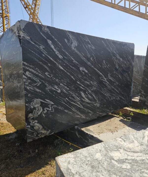 Product Overview: Reliance Titanium Black & Forest Black Granite is a luxurious natural stone celebrated for its striking black background enriched with flowing golden and white veins. Mined from our owned quarry, this granite represents strength, elegance, and timeless beauty — making it a preferred choice for high-end architectural and interior projects across the globe. Each block is a unique creation of nature, offering unmatched character and visual depth. Technical Specifications: Title Reliance Titanium Black & Forest Black Granite Block Stone Type Granite Block Type Gangsaw Block Block Size 300 CM x 180 CM x 180 CM (LXWXH) Color Deep Black with Gold & White Veins Surface Finish Options Wire Saw Cut Density 2960-3000 kg/m3 Compressive Strength 200-250 MPa Water Absorption 0.2%-0.3% Hardness (Mohs) 6 to 7 Porosity Low Origin India Applications Slabs, Countertops, Flooring, Wall Cladding, Interior Key Features: Elegant Aesthetic Appeal: Deep jet-black background enhanced by golden and silver waves — a naturally luxurious look. Superior Strength & Durability: Excellent structural integrity and long-term performance in varied climates. High Polish Retention: Achieves exceptional gloss and mirror-like reflection after finishing. Consistent Texture: Uniform color and grain suitable for large-scale architectural applications. Versatile Application Range: Perfect for multiple interior purposes. Low Maintenance: Resistant to stains, scratches, and moisture, ensuring lasting beauty with minimal upkeep. Export-Grade Blocks: Carefully selected and cut for optimal slab yield and international market standards. Recommended Uses: Kitchen Countertops & Islands Luxury Flooring & Staircases Hotel Lobbies & Reception Areas Wall Cladding & Facades Memorials & Monuments Designer Furniture Tops Why Choose Reliance Titanium Black Granite and Forest Black Granite? Our granite is preferred by export buyers because of: Natural white veins and attractive deep black surface Zero crack, high strength and durability, suitable for projects & reprocessing Consistent Gang Saw block sizes Strict quality checks for each block before shipment Reliable and stable long-term supply Export Capabilities & Payment Terms: We provide smooth, professional export handling with: Payment Options: L/C at sight (Letter of Credit at sight) D/P (Documents Against Payment) T/T advance (if preferred by the buyer) Shipping Documents Provided: Bill of Lading (BL) Commercial Invoice Packing List Certificate of Origin Other documents as per buyer requirements Shipping Price Options: FOB (Indian Port) CNF (any destination port globally) Our logistics team ensures timely loading, documentation, and shipment coordination for a hassle-free experience. About Reliance Mines & Minerals We have a strong presence in the global stone industry, regularly exporting to China, Germany, USA, Oman, and Qatar . Our team is experienced in international trade procedures, ensuring professional communication and smooth cooperation with all partners. We Welcome Your Inquiry If your company is seeking a reliable supplier for premium Titanium black & Forest black granite blocks, we would be pleased to offer quotations, block photos, videos and quarry videos and further details. We look forward to establishing a long-term and successful business relationship with your esteemed company. More About Reliance Titanium Black & Forest Black Granite: Reliance Titanium Black & Forest Black Granite combines natural elegance with engineering excellence. Its bold veins and premium polish bring sophistication to any architectural space, while its robust physical properties ensure durability even in demanding environments. Each block is meticulously extracted and inspected to meet international export quality benchmarks. Reliance Mines & Minerals specializes in the sales and global export of premium granite blocks and slabs. With years of experience in the stone industry, we have established a strong presence in international markets. We are committed to delivering top-quality granite with timely and reliable shipments to major ports worldwide. Our dedicated sales and logistics team is highly skilled in managing export documentation, container loading, and shipping procedures, ensuring a smooth and hassle-free experience for our clients. At the heart of our business is a focus on excellence, professionalism, and customer satisfaction, making us a trusted partner for granite buyers around the globe. 印度 花岗岩 块料 泰坦黑 花岗岩 印度 森林黑 花岗岩 印度 印度 花岗岩 块料, 印度 出口 花岗岩 块, 印度花岗岩原石 中国进口 India granite block Titanium Black granite India Forest Black granite India Granite Blocks Titanium Black Granite Reliance Titanium Black Granite Titanium Black Granite Slabs Polished Titanium Black Granite Bookmatch Titanium Black Granite Titanium Black Granite Exporters India Titanium Black Granite Suppliers Titanium Black Granite Manufacturers Exotic Black Granite with White Veins Deep Black Granite Slabs Mirror Polished Granite Luxury Granite for Interior Walls Natural Stone for Modern Architecture High Gloss Granite Panels Bookmatched Granite Wall Design Black Granite for Hotel Lobby & Flooring Designer Granite Slabs for Projects Indian Granite Exporters Premium Granite from India Granite Slabs for Export Worldwide Granite Supplier Natural Stone Exporter from India Wholesale Granite Supplier Black Granite for Construction & Interiors Architectural Granite Stone Supplier Custom Cut Granite Slabs Export Granite for Wall Cladding Granite for Flooring Granite for Kitchen Countertops Granite for Hotel & Commercial Projects Interior Stone Cladding Luxury Stone for Architects & Designers Black Forest Granite supplier Black Forest Granite manufacturer Black Forest Granite exporter Black Forest Granite quarry Black Forest Granite wholesaler Black Forest Granite seller Buy Black Forest Granite blocks Buy Black Forest Granite slabs Black Forest Granite for flooring Black Forest Granite for countertops Black Forest Granite for wall cladding Black Forest Granite price per sqm Black Forest Granite bulk supplier Black Forest Granite block exporter Black Forest Granite slab manufacturer Black Forest Granite quarry owner Black Forest Granite wholesale price Black Forest Granite large quantity supplier Black Forest Granite custom sizes Black Forest Granite supplier India Black Forest Granite manufacturer India Black Forest Granite exporter India Black Forest Granite quarry India Black Forest Granite supplier [Your City/State] Black Forest Granite international exporter Premium Black Forest Granite supplier Natural Black Forest Granite stone High quality Black Forest Granite slabs Black Forest Granite direct from quarry Black Forest Granite blocks for export Black Forest Granite polished slabs Black granite stone supplier Natural granite stone exporter Indian black granite manufacturer Granite blocks and slabs exporter Dimension stone granite supplier Nebula Wave Granite Stone Manufacturer Export Quality Blocks Supplier Quarry Reliance Mines India Titanium Black Granite Stone Manufacturer Export Quality Blocks Supplier Quarry Reliance Mines India Cosmic Black Granite Stone Manufacturer Export Quality Blocks Supplier Quarry Reliance Mines India Marquina Black Granite Stone Manufacturer Export Quality Blocks Supplier Quarry Reliance Mines India Black Forest Granite Stone Manufacturer Export Quality Blocks Supplier Quarry Reliance Mines India #TitaniumBlackGranite #RelianceGranite #IndianGranite #GraniteExporter #LuxuryGranite #GraniteSupplier #BlackGranite #NaturalStoneIndia #GraniteSlabs #GraniteBookmatch #InteriorDesignStone #ArchitecturalStone #PremiumGranite #GraniteExport #GraniteDesigns #reliancemines #granite #marble #stone #quarry #forestblackgranite