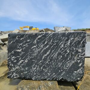 Product Overview: Reliance Titanium Black & Forest Black Granite is a luxurious natural stone celebrated for its striking black background enriched with flowing golden and white veins. Mined from our owned quarry, this granite represents strength, elegance, and timeless beauty — making it a preferred choice for high-end architectural and interior projects across the globe. Each block is a unique creation of nature, offering unmatched character and visual depth. Technical Specifications: Title Reliance Titanium Black & Forest Black Granite Block Stone Type Granite Block Type Gangsaw Block Block Size 300 CM x 180 CM x 180 CM (LXWXH) Color Deep Black with Gold & White Veins Surface Finish Options Wire Saw Cut Density 2960-3000 kg/m3 Compressive Strength 200-250 MPa Water Absorption 0.2%-0.3% Hardness (Mohs) 6 to 7 Porosity Low Origin India Applications Slabs, Countertops, Flooring, Wall Cladding, Interior Key Features: Elegant Aesthetic Appeal: Deep jet-black background enhanced by golden and silver waves — a naturally luxurious look. Superior Strength & Durability: Excellent structural integrity and long-term performance in varied climates. High Polish Retention: Achieves exceptional gloss and mirror-like reflection after finishing. Consistent Texture: Uniform color and grain suitable for large-scale architectural applications. Versatile Application Range: Perfect for multiple interior purposes. Low Maintenance: Resistant to stains, scratches, and moisture, ensuring lasting beauty with minimal upkeep. Export-Grade Blocks: Carefully selected and cut for optimal slab yield and international market standards. Recommended Uses: Kitchen Countertops & Islands Luxury Flooring & Staircases Hotel Lobbies & Reception Areas Wall Cladding & Facades Memorials & Monuments Designer Furniture Tops Why Choose Reliance Titanium Black Granite and Forest Black Granite? Our granite is preferred by export buyers because of: Natural white veins and attractive deep black surface Zero crack, high strength and durability, suitable for projects & reprocessing Consistent Gang Saw block sizes Strict quality checks for each block before shipment Reliable and stable long-term supply Export Capabilities & Payment Terms: We provide smooth, professional export handling with: Payment Options: L/C at sight (Letter of Credit at sight) D/P (Documents Against Payment) T/T advance (if preferred by the buyer) Shipping Documents Provided: Bill of Lading (BL) Commercial Invoice Packing List Certificate of Origin Other documents as per buyer requirements Shipping Price Options: FOB (Indian Port) CNF (any destination port globally) Our logistics team ensures timely loading, documentation, and shipment coordination for a hassle-free experience. About Reliance Mines & Minerals We have a strong presence in the global stone industry, regularly exporting to China, Germany, USA, Oman, and Qatar . Our team is experienced in international trade procedures, ensuring professional communication and smooth cooperation with all partners. We Welcome Your Inquiry If your company is seeking a reliable supplier for premium Titanium black & Forest black granite blocks, we would be pleased to offer quotations, block photos, videos and quarry videos and further details. We look forward to establishing a long-term and successful business relationship with your esteemed company. More About Reliance Titanium Black & Forest Black Granite: Reliance Titanium Black & Forest Black Granite combines natural elegance with engineering excellence. Its bold veins and premium polish bring sophistication to any architectural space, while its robust physical properties ensure durability even in demanding environments. Each block is meticulously extracted and inspected to meet international export quality benchmarks. Reliance Mines & Minerals specializes in the sales and global export of premium granite blocks and slabs. With years of experience in the stone industry, we have established a strong presence in international markets. We are committed to delivering top-quality granite with timely and reliable shipments to major ports worldwide. Our dedicated sales and logistics team is highly skilled in managing export documentation, container loading, and shipping procedures, ensuring a smooth and hassle-free experience for our clients. At the heart of our business is a focus on excellence, professionalism, and customer satisfaction, making us a trusted partner for granite buyers around the globe. 印度 花岗岩 块料 泰坦黑 花岗岩 印度 森林黑 花岗岩 印度 印度 花岗岩 块料, 印度 出口 花岗岩 块, 印度花岗岩原石 中国进口 India granite block Titanium Black granite India Forest Black granite India Granite Blocks Titanium Black Granite Reliance Titanium Black Granite Titanium Black Granite Slabs Polished Titanium Black Granite Bookmatch Titanium Black Granite Titanium Black Granite Exporters India Titanium Black Granite Suppliers Titanium Black Granite Manufacturers Exotic Black Granite with White Veins Deep Black Granite Slabs Mirror Polished Granite Luxury Granite for Interior Walls Natural Stone for Modern Architecture High Gloss Granite Panels Bookmatched Granite Wall Design Black Granite for Hotel Lobby & Flooring Designer Granite Slabs for Projects Indian Granite Exporters Premium Granite from India Granite Slabs for Export Worldwide Granite Supplier Natural Stone Exporter from India Wholesale Granite Supplier Black Granite for Construction & Interiors Architectural Granite Stone Supplier Custom Cut Granite Slabs Export Granite for Wall Cladding Granite for Flooring Granite for Kitchen Countertops Granite for Hotel & Commercial Projects Interior Stone Cladding Luxury Stone for Architects & Designers Black Forest Granite supplier Black Forest Granite manufacturer Black Forest Granite exporter Black Forest Granite quarry Black Forest Granite wholesaler Black Forest Granite seller Buy Black Forest Granite blocks Buy Black Forest Granite slabs Black Forest Granite for flooring Black Forest Granite for countertops Black Forest Granite for wall cladding Black Forest Granite price per sqm Black Forest Granite bulk supplier Black Forest Granite block exporter Black Forest Granite slab manufacturer Black Forest Granite quarry owner Black Forest Granite wholesale price Black Forest Granite large quantity supplier Black Forest Granite custom sizes Black Forest Granite supplier India Black Forest Granite manufacturer India Black Forest Granite exporter India Black Forest Granite quarry India Black Forest Granite supplier [Your City/State] Black Forest Granite international exporter Premium Black Forest Granite supplier Natural Black Forest Granite stone High quality Black Forest Granite slabs Black Forest Granite direct from quarry Black Forest Granite blocks for export Black Forest Granite polished slabs Black granite stone supplier Natural granite stone exporter Indian black granite manufacturer Granite blocks and slabs exporter Dimension stone granite supplier Nebula Wave Granite Stone Manufacturer Export Quality Blocks Supplier Quarry Reliance Mines India Titanium Black Granite Stone Manufacturer Export Quality Blocks Supplier Quarry Reliance Mines India Cosmic Black Granite Stone Manufacturer Export Quality Blocks Supplier Quarry Reliance Mines India Marquina Black Granite Stone Manufacturer Export Quality Blocks Supplier Quarry Reliance Mines India Black Forest Granite Stone Manufacturer Export Quality Blocks Supplier Quarry Reliance Mines India #TitaniumBlackGranite #RelianceGranite #IndianGranite #GraniteExporter #LuxuryGranite #GraniteSupplier #BlackGranite #NaturalStoneIndia #GraniteSlabs #GraniteBookmatch #InteriorDesignStone #ArchitecturalStone #PremiumGranite #GraniteExport #GraniteDesigns #reliancemines #granite #marble #stone #quarry #forestblackgranite