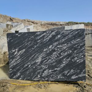 Product Overview: Reliance Titanium Black & Forest Black Granite is a luxurious natural stone celebrated for its striking black background enriched with flowing golden and white veins. Mined from our owned quarry, this granite represents strength, elegance, and timeless beauty — making it a preferred choice for high-end architectural and interior projects across the globe. Each block is a unique creation of nature, offering unmatched character and visual depth. Technical Specifications: Title Reliance Titanium Black & Forest Black Granite Block Stone Type Granite Block Type Gangsaw Block Block Size 300 CM x 180 CM x 180 CM (LXWXH) Color Deep Black with Gold & White Veins Surface Finish Options Wire Saw Cut Density 2960-3000 kg/m3 Compressive Strength 200-250 MPa Water Absorption 0.2%-0.3% Hardness (Mohs) 6 to 7 Porosity Low Origin India Applications Slabs, Countertops, Flooring, Wall Cladding, Interior Key Features: Elegant Aesthetic Appeal: Deep jet-black background enhanced by golden and silver waves — a naturally luxurious look. Superior Strength & Durability: Excellent structural integrity and long-term performance in varied climates. High Polish Retention: Achieves exceptional gloss and mirror-like reflection after finishing. Consistent Texture: Uniform color and grain suitable for large-scale architectural applications. Versatile Application Range: Perfect for multiple interior purposes. Low Maintenance: Resistant to stains, scratches, and moisture, ensuring lasting beauty with minimal upkeep. Export-Grade Blocks: Carefully selected and cut for optimal slab yield and international market standards. Recommended Uses: Kitchen Countertops & Islands Luxury Flooring & Staircases Hotel Lobbies & Reception Areas Wall Cladding & Facades Memorials & Monuments Designer Furniture Tops Why Choose Reliance Titanium Black Granite and Forest Black Granite? Our granite is preferred by export buyers because of: Natural white veins and attractive deep black surface Zero crack, high strength and durability, suitable for projects & reprocessing Consistent Gang Saw block sizes Strict quality checks for each block before shipment Reliable and stable long-term supply Export Capabilities & Payment Terms: We provide smooth, professional export handling with: Payment Options: L/C at sight (Letter of Credit at sight) D/P (Documents Against Payment) T/T advance (if preferred by the buyer) Shipping Documents Provided: Bill of Lading (BL) Commercial Invoice Packing List Certificate of Origin Other documents as per buyer requirements Shipping Price Options: FOB (Indian Port) CNF (any destination port globally) Our logistics team ensures timely loading, documentation, and shipment coordination for a hassle-free experience. About Reliance Mines & Minerals We have a strong presence in the global stone industry, regularly exporting to China, Germany, USA, Oman, and Qatar . Our team is experienced in international trade procedures, ensuring professional communication and smooth cooperation with all partners. We Welcome Your Inquiry If your company is seeking a reliable supplier for premium Titanium black & Forest black granite blocks, we would be pleased to offer quotations, block photos, videos and quarry videos and further details. We look forward to establishing a long-term and successful business relationship with your esteemed company. More About Reliance Titanium Black & Forest Black Granite: Reliance Titanium Black & Forest Black Granite combines natural elegance with engineering excellence. Its bold veins and premium polish bring sophistication to any architectural space, while its robust physical properties ensure durability even in demanding environments. Each block is meticulously extracted and inspected to meet international export quality benchmarks. Reliance Mines & Minerals specializes in the sales and global export of premium granite blocks and slabs. With years of experience in the stone industry, we have established a strong presence in international markets. We are committed to delivering top-quality granite with timely and reliable shipments to major ports worldwide. Our dedicated sales and logistics team is highly skilled in managing export documentation, container loading, and shipping procedures, ensuring a smooth and hassle-free experience for our clients. At the heart of our business is a focus on excellence, professionalism, and customer satisfaction, making us a trusted partner for granite buyers around the globe. 印度 花岗岩 块料 泰坦黑 花岗岩 印度 森林黑 花岗岩 印度 印度 花岗岩 块料, 印度 出口 花岗岩 块, 印度花岗岩原石 中国进口 India granite block Titanium Black granite India Forest Black granite India Granite Blocks Titanium Black Granite Reliance Titanium Black Granite Titanium Black Granite Slabs Polished Titanium Black Granite Bookmatch Titanium Black Granite Titanium Black Granite Exporters India Titanium Black Granite Suppliers Titanium Black Granite Manufacturers Exotic Black Granite with White Veins Deep Black Granite Slabs Mirror Polished Granite Luxury Granite for Interior Walls Natural Stone for Modern Architecture High Gloss Granite Panels Bookmatched Granite Wall Design Black Granite for Hotel Lobby & Flooring Designer Granite Slabs for Projects Indian Granite Exporters Premium Granite from India Granite Slabs for Export Worldwide Granite Supplier Natural Stone Exporter from India Wholesale Granite Supplier Black Granite for Construction & Interiors Architectural Granite Stone Supplier Custom Cut Granite Slabs Export Granite for Wall Cladding Granite for Flooring Granite for Kitchen Countertops Granite for Hotel & Commercial Projects Interior Stone Cladding Luxury Stone for Architects & Designers Black Forest Granite supplier Black Forest Granite manufacturer Black Forest Granite exporter Black Forest Granite quarry Black Forest Granite wholesaler Black Forest Granite seller Buy Black Forest Granite blocks Buy Black Forest Granite slabs Black Forest Granite for flooring Black Forest Granite for countertops Black Forest Granite for wall cladding Black Forest Granite price per sqm Black Forest Granite bulk supplier Black Forest Granite block exporter Black Forest Granite slab manufacturer Black Forest Granite quarry owner Black Forest Granite wholesale price Black Forest Granite large quantity supplier Black Forest Granite custom sizes Black Forest Granite supplier India Black Forest Granite manufacturer India Black Forest Granite exporter India Black Forest Granite quarry India Black Forest Granite supplier [Your City/State] Black Forest Granite international exporter Premium Black Forest Granite supplier Natural Black Forest Granite stone High quality Black Forest Granite slabs Black Forest Granite direct from quarry Black Forest Granite blocks for export Black Forest Granite polished slabs Black granite stone supplier Natural granite stone exporter Indian black granite manufacturer Granite blocks and slabs exporter Dimension stone granite supplier Nebula Wave Granite Stone Manufacturer Export Quality Blocks Supplier Quarry Reliance Mines India Titanium Black Granite Stone Manufacturer Export Quality Blocks Supplier Quarry Reliance Mines India Cosmic Black Granite Stone Manufacturer Export Quality Blocks Supplier Quarry Reliance Mines India Marquina Black Granite Stone Manufacturer Export Quality Blocks Supplier Quarry Reliance Mines India Black Forest Granite Stone Manufacturer Export Quality Blocks Supplier Quarry Reliance Mines India #TitaniumBlackGranite #RelianceGranite #IndianGranite #GraniteExporter #LuxuryGranite #GraniteSupplier #BlackGranite #NaturalStoneIndia #GraniteSlabs #GraniteBookmatch #InteriorDesignStone #ArchitecturalStone #PremiumGranite #GraniteExport #GraniteDesigns #reliancemines #granite #marble #stone #quarry #forestblackgranite