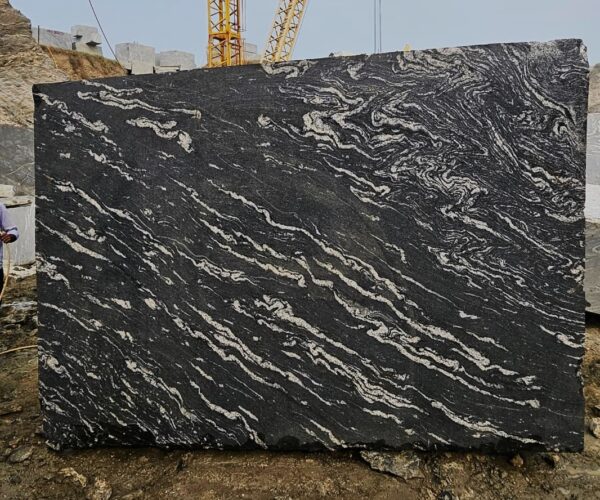 Product Overview: Reliance Titanium Black & Forest Black Granite is a luxurious natural stone celebrated for its striking black background enriched with flowing golden and white veins. Mined from our owned quarry, this granite represents strength, elegance, and timeless beauty — making it a preferred choice for high-end architectural and interior projects across the globe. Each block is a unique creation of nature, offering unmatched character and visual depth. Technical Specifications: Title Reliance Titanium Black & Forest Black Granite Block Stone Type Granite Block Type Gangsaw Block Block Size 300 CM x 180 CM x 180 CM (LXWXH) Color Deep Black with Gold & White Veins Surface Finish Options Wire Saw Cut Density 2960-3000 kg/m3 Compressive Strength 200-250 MPa Water Absorption 0.2%-0.3% Hardness (Mohs) 6 to 7 Porosity Low Origin India Applications Slabs, Countertops, Flooring, Wall Cladding, Interior Key Features: Elegant Aesthetic Appeal: Deep jet-black background enhanced by golden and silver waves — a naturally luxurious look. Superior Strength & Durability: Excellent structural integrity and long-term performance in varied climates. High Polish Retention: Achieves exceptional gloss and mirror-like reflection after finishing. Consistent Texture: Uniform color and grain suitable for large-scale architectural applications. Versatile Application Range: Perfect for multiple interior purposes. Low Maintenance: Resistant to stains, scratches, and moisture, ensuring lasting beauty with minimal upkeep. Export-Grade Blocks: Carefully selected and cut for optimal slab yield and international market standards. Recommended Uses: Kitchen Countertops & Islands Luxury Flooring & Staircases Hotel Lobbies & Reception Areas Wall Cladding & Facades Memorials & Monuments Designer Furniture Tops Why Choose Reliance Titanium Black Granite and Forest Black Granite? Our granite is preferred by export buyers because of: Natural white veins and attractive deep black surface Zero crack, high strength and durability, suitable for projects & reprocessing Consistent Gang Saw block sizes Strict quality checks for each block before shipment Reliable and stable long-term supply Export Capabilities & Payment Terms: We provide smooth, professional export handling with: Payment Options: L/C at sight (Letter of Credit at sight) D/P (Documents Against Payment) T/T advance (if preferred by the buyer) Shipping Documents Provided: Bill of Lading (BL) Commercial Invoice Packing List Certificate of Origin Other documents as per buyer requirements Shipping Price Options: FOB (Indian Port) CNF (any destination port globally) Our logistics team ensures timely loading, documentation, and shipment coordination for a hassle-free experience. About Reliance Mines & Minerals We have a strong presence in the global stone industry, regularly exporting to China, Germany, USA, Oman, and Qatar . Our team is experienced in international trade procedures, ensuring professional communication and smooth cooperation with all partners. We Welcome Your Inquiry If your company is seeking a reliable supplier for premium Titanium black & Forest black granite blocks, we would be pleased to offer quotations, block photos, videos and quarry videos and further details. We look forward to establishing a long-term and successful business relationship with your esteemed company. More About Reliance Titanium Black & Forest Black Granite: Reliance Titanium Black & Forest Black Granite combines natural elegance with engineering excellence. Its bold veins and premium polish bring sophistication to any architectural space, while its robust physical properties ensure durability even in demanding environments. Each block is meticulously extracted and inspected to meet international export quality benchmarks. Reliance Mines & Minerals specializes in the sales and global export of premium granite blocks and slabs. With years of experience in the stone industry, we have established a strong presence in international markets. We are committed to delivering top-quality granite with timely and reliable shipments to major ports worldwide. Our dedicated sales and logistics team is highly skilled in managing export documentation, container loading, and shipping procedures, ensuring a smooth and hassle-free experience for our clients. At the heart of our business is a focus on excellence, professionalism, and customer satisfaction, making us a trusted partner for granite buyers around the globe. 印度 花岗岩 块料 泰坦黑 花岗岩 印度 森林黑 花岗岩 印度 印度 花岗岩 块料, 印度 出口 花岗岩 块, 印度花岗岩原石 中国进口 India granite block Titanium Black granite India Forest Black granite India Granite Blocks Titanium Black Granite Reliance Titanium Black Granite Titanium Black Granite Slabs Polished Titanium Black Granite Bookmatch Titanium Black Granite Titanium Black Granite Exporters India Titanium Black Granite Suppliers Titanium Black Granite Manufacturers Exotic Black Granite with White Veins Deep Black Granite Slabs Mirror Polished Granite Luxury Granite for Interior Walls Natural Stone for Modern Architecture High Gloss Granite Panels Bookmatched Granite Wall Design Black Granite for Hotel Lobby & Flooring Designer Granite Slabs for Projects Indian Granite Exporters Premium Granite from India Granite Slabs for Export Worldwide Granite Supplier Natural Stone Exporter from India Wholesale Granite Supplier Black Granite for Construction & Interiors Architectural Granite Stone Supplier Custom Cut Granite Slabs Export Granite for Wall Cladding Granite for Flooring Granite for Kitchen Countertops Granite for Hotel & Commercial Projects Interior Stone Cladding Luxury Stone for Architects & Designers Black Forest Granite supplier Black Forest Granite manufacturer Black Forest Granite exporter Black Forest Granite quarry Black Forest Granite wholesaler Black Forest Granite seller Buy Black Forest Granite blocks Buy Black Forest Granite slabs Black Forest Granite for flooring Black Forest Granite for countertops Black Forest Granite for wall cladding Black Forest Granite price per sqm Black Forest Granite bulk supplier Black Forest Granite block exporter Black Forest Granite slab manufacturer Black Forest Granite quarry owner Black Forest Granite wholesale price Black Forest Granite large quantity supplier Black Forest Granite custom sizes Black Forest Granite supplier India Black Forest Granite manufacturer India Black Forest Granite exporter India Black Forest Granite quarry India Black Forest Granite supplier [Your City/State] Black Forest Granite international exporter Premium Black Forest Granite supplier Natural Black Forest Granite stone High quality Black Forest Granite slabs Black Forest Granite direct from quarry Black Forest Granite blocks for export Black Forest Granite polished slabs Black granite stone supplier Natural granite stone exporter Indian black granite manufacturer Granite blocks and slabs exporter Dimension stone granite supplier Nebula Wave Granite Stone Manufacturer Export Quality Blocks Supplier Quarry Reliance Mines India Titanium Black Granite Stone Manufacturer Export Quality Blocks Supplier Quarry Reliance Mines India Cosmic Black Granite Stone Manufacturer Export Quality Blocks Supplier Quarry Reliance Mines India Marquina Black Granite Stone Manufacturer Export Quality Blocks Supplier Quarry Reliance Mines India Black Forest Granite Stone Manufacturer Export Quality Blocks Supplier Quarry Reliance Mines India #TitaniumBlackGranite #RelianceGranite #IndianGranite #GraniteExporter #LuxuryGranite #GraniteSupplier #BlackGranite #NaturalStoneIndia #GraniteSlabs #GraniteBookmatch #InteriorDesignStone #ArchitecturalStone #PremiumGranite #GraniteExport #GraniteDesigns #reliancemines #granite #marble #stone #quarry #forestblackgranite