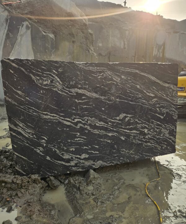 Product Overview: Reliance Titanium Black & Forest Black Granite is a luxurious natural stone celebrated for its striking black background enriched with flowing golden and white veins. Mined from our owned quarry, this granite represents strength, elegance, and timeless beauty — making it a preferred choice for high-end architectural and interior projects across the globe. Each block is a unique creation of nature, offering unmatched character and visual depth. Technical Specifications: Title Reliance Titanium Black & Forest Black Granite Block Stone Type Granite Block Type Gangsaw Block Block Size 300 CM x 180 CM x 180 CM (LXWXH) Color Deep Black with Gold & White Veins Surface Finish Options Wire Saw Cut Density 2960-3000 kg/m3 Compressive Strength 200-250 MPa Water Absorption 0.2%-0.3% Hardness (Mohs) 6 to 7 Porosity Low Origin India Applications Slabs, Countertops, Flooring, Wall Cladding, Interior Key Features: Elegant Aesthetic Appeal: Deep jet-black background enhanced by golden and silver waves — a naturally luxurious look. Superior Strength & Durability: Excellent structural integrity and long-term performance in varied climates. High Polish Retention: Achieves exceptional gloss and mirror-like reflection after finishing. Consistent Texture: Uniform color and grain suitable for large-scale architectural applications. Versatile Application Range: Perfect for multiple interior purposes. Low Maintenance: Resistant to stains, scratches, and moisture, ensuring lasting beauty with minimal upkeep. Export-Grade Blocks: Carefully selected and cut for optimal slab yield and international market standards. Recommended Uses: Kitchen Countertops & Islands Luxury Flooring & Staircases Hotel Lobbies & Reception Areas Wall Cladding & Facades Memorials & Monuments Designer Furniture Tops Why Choose Reliance Titanium Black Granite and Forest Black Granite? Our granite is preferred by export buyers because of: Natural white veins and attractive deep black surface Zero crack, high strength and durability, suitable for projects & reprocessing Consistent Gang Saw block sizes Strict quality checks for each block before shipment Reliable and stable long-term supply Export Capabilities & Payment Terms: We provide smooth, professional export handling with: Payment Options: L/C at sight (Letter of Credit at sight) D/P (Documents Against Payment) T/T advance (if preferred by the buyer) Shipping Documents Provided: Bill of Lading (BL) Commercial Invoice Packing List Certificate of Origin Other documents as per buyer requirements Shipping Price Options: FOB (Indian Port) CNF (any destination port globally) Our logistics team ensures timely loading, documentation, and shipment coordination for a hassle-free experience. About Reliance Mines & Minerals We have a strong presence in the global stone industry, regularly exporting to China, Germany, USA, Oman, and Qatar . Our team is experienced in international trade procedures, ensuring professional communication and smooth cooperation with all partners. We Welcome Your Inquiry If your company is seeking a reliable supplier for premium Titanium black & Forest black granite blocks, we would be pleased to offer quotations, block photos, videos and quarry videos and further details. We look forward to establishing a long-term and successful business relationship with your esteemed company. More About Reliance Titanium Black & Forest Black Granite: Reliance Titanium Black & Forest Black Granite combines natural elegance with engineering excellence. Its bold veins and premium polish bring sophistication to any architectural space, while its robust physical properties ensure durability even in demanding environments. Each block is meticulously extracted and inspected to meet international export quality benchmarks. Reliance Mines & Minerals specializes in the sales and global export of premium granite blocks and slabs. With years of experience in the stone industry, we have established a strong presence in international markets. We are committed to delivering top-quality granite with timely and reliable shipments to major ports worldwide. Our dedicated sales and logistics team is highly skilled in managing export documentation, container loading, and shipping procedures, ensuring a smooth and hassle-free experience for our clients. At the heart of our business is a focus on excellence, professionalism, and customer satisfaction, making us a trusted partner for granite buyers around the globe. 印度 花岗岩 块料 泰坦黑 花岗岩 印度 森林黑 花岗岩 印度 印度 花岗岩 块料, 印度 出口 花岗岩 块, 印度花岗岩原石 中国进口 India granite block Titanium Black granite India Forest Black granite India Granite Blocks Titanium Black Granite Reliance Titanium Black Granite Titanium Black Granite Slabs Polished Titanium Black Granite Bookmatch Titanium Black Granite Titanium Black Granite Exporters India Titanium Black Granite Suppliers Titanium Black Granite Manufacturers Exotic Black Granite with White Veins Deep Black Granite Slabs Mirror Polished Granite Luxury Granite for Interior Walls Natural Stone for Modern Architecture High Gloss Granite Panels Bookmatched Granite Wall Design Black Granite for Hotel Lobby & Flooring Designer Granite Slabs for Projects Indian Granite Exporters Premium Granite from India Granite Slabs for Export Worldwide Granite Supplier Natural Stone Exporter from India Wholesale Granite Supplier Black Granite for Construction & Interiors Architectural Granite Stone Supplier Custom Cut Granite Slabs Export Granite for Wall Cladding Granite for Flooring Granite for Kitchen Countertops Granite for Hotel & Commercial Projects Interior Stone Cladding Luxury Stone for Architects & Designers Black Forest Granite supplier Black Forest Granite manufacturer Black Forest Granite exporter Black Forest Granite quarry Black Forest Granite wholesaler Black Forest Granite seller Buy Black Forest Granite blocks Buy Black Forest Granite slabs Black Forest Granite for flooring Black Forest Granite for countertops Black Forest Granite for wall cladding Black Forest Granite price per sqm Black Forest Granite bulk supplier Black Forest Granite block exporter Black Forest Granite slab manufacturer Black Forest Granite quarry owner Black Forest Granite wholesale price Black Forest Granite large quantity supplier Black Forest Granite custom sizes Black Forest Granite supplier India Black Forest Granite manufacturer India Black Forest Granite exporter India Black Forest Granite quarry India Black Forest Granite supplier [Your City/State] Black Forest Granite international exporter Premium Black Forest Granite supplier Natural Black Forest Granite stone High quality Black Forest Granite slabs Black Forest Granite direct from quarry Black Forest Granite blocks for export Black Forest Granite polished slabs Black granite stone supplier Natural granite stone exporter Indian black granite manufacturer Granite blocks and slabs exporter Dimension stone granite supplier Nebula Wave Granite Stone Manufacturer Export Quality Blocks Supplier Quarry Reliance Mines India Titanium Black Granite Stone Manufacturer Export Quality Blocks Supplier Quarry Reliance Mines India Cosmic Black Granite Stone Manufacturer Export Quality Blocks Supplier Quarry Reliance Mines India Marquina Black Granite Stone Manufacturer Export Quality Blocks Supplier Quarry Reliance Mines India Black Forest Granite Stone Manufacturer Export Quality Blocks Supplier Quarry Reliance Mines India #TitaniumBlackGranite #RelianceGranite #IndianGranite #GraniteExporter #LuxuryGranite #GraniteSupplier #BlackGranite #NaturalStoneIndia #GraniteSlabs #GraniteBookmatch #InteriorDesignStone #ArchitecturalStone #PremiumGranite #GraniteExport #GraniteDesigns #reliancemines #granite #marble #stone #quarry #forestblackgranite