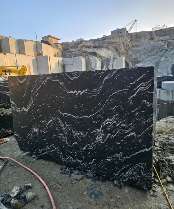 Product Overview: Reliance Titanium Black & Forest Black Granite is a luxurious natural stone celebrated for its striking black background enriched with flowing golden and white veins. Mined from our owned quarry, this granite represents strength, elegance, and timeless beauty — making it a preferred choice for high-end architectural and interior projects across the globe. Each block is a unique creation of nature, offering unmatched character and visual depth. Technical Specifications: Title Reliance Titanium Black & Forest Black Granite Block Stone Type Granite Block Type Gangsaw Block Block Size 300 CM x 180 CM x 180 CM (LXWXH) Color Deep Black with Gold & White Veins Surface Finish Options Wire Saw Cut Density 2960-3000 kg/m3 Compressive Strength 200-250 MPa Water Absorption 0.2%-0.3% Hardness (Mohs) 6 to 7 Porosity Low Origin India Applications Slabs, Countertops, Flooring, Wall Cladding, Interior Key Features: Elegant Aesthetic Appeal: Deep jet-black background enhanced by golden and silver waves — a naturally luxurious look. Superior Strength & Durability: Excellent structural integrity and long-term performance in varied climates. High Polish Retention: Achieves exceptional gloss and mirror-like reflection after finishing. Consistent Texture: Uniform color and grain suitable for large-scale architectural applications. Versatile Application Range: Perfect for multiple interior purposes. Low Maintenance: Resistant to stains, scratches, and moisture, ensuring lasting beauty with minimal upkeep. Export-Grade Blocks: Carefully selected and cut for optimal slab yield and international market standards. Recommended Uses: Kitchen Countertops & Islands Luxury Flooring & Staircases Hotel Lobbies & Reception Areas Wall Cladding & Facades Memorials & Monuments Designer Furniture Tops Why Choose Reliance Titanium Black Granite and Forest Black Granite? Our granite is preferred by export buyers because of: Natural white veins and attractive deep black surface Zero crack, high strength and durability, suitable for projects & reprocessing Consistent Gang Saw block sizes Strict quality checks for each block before shipment Reliable and stable long-term supply Export Capabilities & Payment Terms: We provide smooth, professional export handling with: Payment Options: L/C at sight (Letter of Credit at sight) D/P (Documents Against Payment) T/T advance (if preferred by the buyer) Shipping Documents Provided: Bill of Lading (BL) Commercial Invoice Packing List Certificate of Origin Other documents as per buyer requirements Shipping Price Options: FOB (Indian Port) CNF (any destination port globally) Our logistics team ensures timely loading, documentation, and shipment coordination for a hassle-free experience. About Reliance Mines & Minerals We have a strong presence in the global stone industry, regularly exporting to China, Germany, USA, Oman, and Qatar . Our team is experienced in international trade procedures, ensuring professional communication and smooth cooperation with all partners. We Welcome Your Inquiry If your company is seeking a reliable supplier for premium Titanium black & Forest black granite blocks, we would be pleased to offer quotations, block photos, videos and quarry videos and further details. We look forward to establishing a long-term and successful business relationship with your esteemed company. More About Reliance Titanium Black & Forest Black Granite: Reliance Titanium Black & Forest Black Granite combines natural elegance with engineering excellence. Its bold veins and premium polish bring sophistication to any architectural space, while its robust physical properties ensure durability even in demanding environments. Each block is meticulously extracted and inspected to meet international export quality benchmarks. Reliance Mines & Minerals specializes in the sales and global export of premium granite blocks and slabs. With years of experience in the stone industry, we have established a strong presence in international markets. We are committed to delivering top-quality granite with timely and reliable shipments to major ports worldwide. Our dedicated sales and logistics team is highly skilled in managing export documentation, container loading, and shipping procedures, ensuring a smooth and hassle-free experience for our clients. At the heart of our business is a focus on excellence, professionalism, and customer satisfaction, making us a trusted partner for granite buyers around the globe. 印度 花岗岩 块料 泰坦黑 花岗岩 印度 森林黑 花岗岩 印度 印度 花岗岩 块料, 印度 出口 花岗岩 块, 印度花岗岩原石 中国进口 India granite block Titanium Black granite India Forest Black granite India Granite Blocks Titanium Black Granite Reliance Titanium Black Granite Titanium Black Granite Slabs Polished Titanium Black Granite Bookmatch Titanium Black Granite Titanium Black Granite Exporters India Titanium Black Granite Suppliers Titanium Black Granite Manufacturers Exotic Black Granite with White Veins Deep Black Granite Slabs Mirror Polished Granite Luxury Granite for Interior Walls Natural Stone for Modern Architecture High Gloss Granite Panels Bookmatched Granite Wall Design Black Granite for Hotel Lobby & Flooring Designer Granite Slabs for Projects Indian Granite Exporters Premium Granite from India Granite Slabs for Export Worldwide Granite Supplier Natural Stone Exporter from India Wholesale Granite Supplier Black Granite for Construction & Interiors Architectural Granite Stone Supplier Custom Cut Granite Slabs Export Granite for Wall Cladding Granite for Flooring Granite for Kitchen Countertops Granite for Hotel & Commercial Projects Interior Stone Cladding Luxury Stone for Architects & Designers Black Forest Granite supplier Black Forest Granite manufacturer Black Forest Granite exporter Black Forest Granite quarry Black Forest Granite wholesaler Black Forest Granite seller Buy Black Forest Granite blocks Buy Black Forest Granite slabs Black Forest Granite for flooring Black Forest Granite for countertops Black Forest Granite for wall cladding Black Forest Granite price per sqm Black Forest Granite bulk supplier Black Forest Granite block exporter Black Forest Granite slab manufacturer Black Forest Granite quarry owner Black Forest Granite wholesale price Black Forest Granite large quantity supplier Black Forest Granite custom sizes Black Forest Granite supplier India Black Forest Granite manufacturer India Black Forest Granite exporter India Black Forest Granite quarry India Black Forest Granite supplier [Your City/State] Black Forest Granite international exporter Premium Black Forest Granite supplier Natural Black Forest Granite stone High quality Black Forest Granite slabs Black Forest Granite direct from quarry Black Forest Granite blocks for export Black Forest Granite polished slabs Black granite stone supplier Natural granite stone exporter Indian black granite manufacturer Granite blocks and slabs exporter Dimension stone granite supplier Nebula Wave Granite Stone Manufacturer Export Quality Blocks Supplier Quarry Reliance Mines India Titanium Black Granite Stone Manufacturer Export Quality Blocks Supplier Quarry Reliance Mines India Cosmic Black Granite Stone Manufacturer Export Quality Blocks Supplier Quarry Reliance Mines India Marquina Black Granite Stone Manufacturer Export Quality Blocks Supplier Quarry Reliance Mines India Black Forest Granite Stone Manufacturer Export Quality Blocks Supplier Quarry Reliance Mines India #TitaniumBlackGranite #RelianceGranite #IndianGranite #GraniteExporter #LuxuryGranite #GraniteSupplier #BlackGranite #NaturalStoneIndia #GraniteSlabs #GraniteBookmatch #InteriorDesignStone #ArchitecturalStone #PremiumGranite #GraniteExport #GraniteDesigns #reliancemines #granite #marble #stone #quarry #forestblackgranite