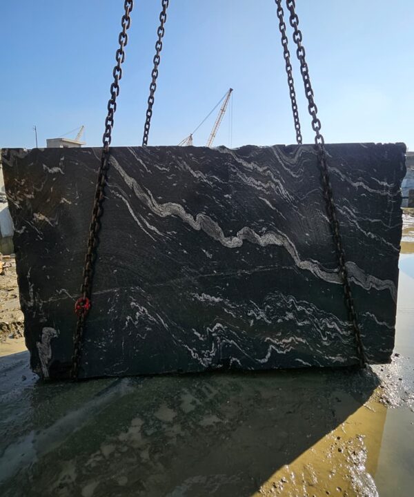 Product Overview: Reliance Titanium Black & Forest Black Granite is a luxurious natural stone celebrated for its striking black background enriched with flowing golden and white veins. Mined from our owned quarry, this granite represents strength, elegance, and timeless beauty — making it a preferred choice for high-end architectural and interior projects across the globe. Each block is a unique creation of nature, offering unmatched character and visual depth. Technical Specifications: Title Reliance Titanium Black & Forest Black Granite Block Stone Type Granite Block Type Gangsaw Block Block Size 300 CM x 180 CM x 180 CM (LXWXH) Color Deep Black with Gold & White Veins Surface Finish Options Wire Saw Cut Density 2960-3000 kg/m3 Compressive Strength 200-250 MPa Water Absorption 0.2%-0.3% Hardness (Mohs) 6 to 7 Porosity Low Origin India Applications Slabs, Countertops, Flooring, Wall Cladding, Interior Key Features: Elegant Aesthetic Appeal: Deep jet-black background enhanced by golden and silver waves — a naturally luxurious look. Superior Strength & Durability: Excellent structural integrity and long-term performance in varied climates. High Polish Retention: Achieves exceptional gloss and mirror-like reflection after finishing. Consistent Texture: Uniform color and grain suitable for large-scale architectural applications. Versatile Application Range: Perfect for multiple interior purposes. Low Maintenance: Resistant to stains, scratches, and moisture, ensuring lasting beauty with minimal upkeep. Export-Grade Blocks: Carefully selected and cut for optimal slab yield and international market standards. Recommended Uses: Kitchen Countertops & Islands Luxury Flooring & Staircases Hotel Lobbies & Reception Areas Wall Cladding & Facades Memorials & Monuments Designer Furniture Tops Why Choose Reliance Titanium Black Granite and Forest Black Granite? Our granite is preferred by export buyers because of: Natural white veins and attractive deep black surface Zero crack, high strength and durability, suitable for projects & reprocessing Consistent Gang Saw block sizes Strict quality checks for each block before shipment Reliable and stable long-term supply Export Capabilities & Payment Terms: We provide smooth, professional export handling with: Payment Options: L/C at sight (Letter of Credit at sight) D/P (Documents Against Payment) T/T advance (if preferred by the buyer) Shipping Documents Provided: Bill of Lading (BL) Commercial Invoice Packing List Certificate of Origin Other documents as per buyer requirements Shipping Price Options: FOB (Indian Port) CNF (any destination port globally) Our logistics team ensures timely loading, documentation, and shipment coordination for a hassle-free experience. About Reliance Mines & Minerals We have a strong presence in the global stone industry, regularly exporting to China, Germany, USA, Oman, and Qatar . Our team is experienced in international trade procedures, ensuring professional communication and smooth cooperation with all partners. We Welcome Your Inquiry If your company is seeking a reliable supplier for premium Titanium black & Forest black granite blocks, we would be pleased to offer quotations, block photos, videos and quarry videos and further details. We look forward to establishing a long-term and successful business relationship with your esteemed company. More About Reliance Titanium Black & Forest Black Granite: Reliance Titanium Black & Forest Black Granite combines natural elegance with engineering excellence. Its bold veins and premium polish bring sophistication to any architectural space, while its robust physical properties ensure durability even in demanding environments. Each block is meticulously extracted and inspected to meet international export quality benchmarks. Reliance Mines & Minerals specializes in the sales and global export of premium granite blocks and slabs. With years of experience in the stone industry, we have established a strong presence in international markets. We are committed to delivering top-quality granite with timely and reliable shipments to major ports worldwide. Our dedicated sales and logistics team is highly skilled in managing export documentation, container loading, and shipping procedures, ensuring a smooth and hassle-free experience for our clients. At the heart of our business is a focus on excellence, professionalism, and customer satisfaction, making us a trusted partner for granite buyers around the globe. 印度 花岗岩 块料 泰坦黑 花岗岩 印度 森林黑 花岗岩 印度 印度 花岗岩 块料, 印度 出口 花岗岩 块, 印度花岗岩原石 中国进口 India granite block Titanium Black granite India Forest Black granite India Granite Blocks Titanium Black Granite Reliance Titanium Black Granite Titanium Black Granite Slabs Polished Titanium Black Granite Bookmatch Titanium Black Granite Titanium Black Granite Exporters India Titanium Black Granite Suppliers Titanium Black Granite Manufacturers Exotic Black Granite with White Veins Deep Black Granite Slabs Mirror Polished Granite Luxury Granite for Interior Walls Natural Stone for Modern Architecture High Gloss Granite Panels Bookmatched Granite Wall Design Black Granite for Hotel Lobby & Flooring Designer Granite Slabs for Projects Indian Granite Exporters Premium Granite from India Granite Slabs for Export Worldwide Granite Supplier Natural Stone Exporter from India Wholesale Granite Supplier Black Granite for Construction & Interiors Architectural Granite Stone Supplier Custom Cut Granite Slabs Export Granite for Wall Cladding Granite for Flooring Granite for Kitchen Countertops Granite for Hotel & Commercial Projects Interior Stone Cladding Luxury Stone for Architects & Designers Black Forest Granite supplier Black Forest Granite manufacturer Black Forest Granite exporter Black Forest Granite quarry Black Forest Granite wholesaler Black Forest Granite seller Buy Black Forest Granite blocks Buy Black Forest Granite slabs Black Forest Granite for flooring Black Forest Granite for countertops Black Forest Granite for wall cladding Black Forest Granite price per sqm Black Forest Granite bulk supplier Black Forest Granite block exporter Black Forest Granite slab manufacturer Black Forest Granite quarry owner Black Forest Granite wholesale price Black Forest Granite large quantity supplier Black Forest Granite custom sizes Black Forest Granite supplier India Black Forest Granite manufacturer India Black Forest Granite exporter India Black Forest Granite quarry India Black Forest Granite supplier [Your City/State] Black Forest Granite international exporter Premium Black Forest Granite supplier Natural Black Forest Granite stone High quality Black Forest Granite slabs Black Forest Granite direct from quarry Black Forest Granite blocks for export Black Forest Granite polished slabs Black granite stone supplier Natural granite stone exporter Indian black granite manufacturer Granite blocks and slabs exporter Dimension stone granite supplier Nebula Wave Granite Stone Manufacturer Export Quality Blocks Supplier Quarry Reliance Mines India Titanium Black Granite Stone Manufacturer Export Quality Blocks Supplier Quarry Reliance Mines India Cosmic Black Granite Stone Manufacturer Export Quality Blocks Supplier Quarry Reliance Mines India Marquina Black Granite Stone Manufacturer Export Quality Blocks Supplier Quarry Reliance Mines India Black Forest Granite Stone Manufacturer Export Quality Blocks Supplier Quarry Reliance Mines India #TitaniumBlackGranite #RelianceGranite #IndianGranite #GraniteExporter #LuxuryGranite #GraniteSupplier #BlackGranite #NaturalStoneIndia #GraniteSlabs #GraniteBookmatch #InteriorDesignStone #ArchitecturalStone #PremiumGranite #GraniteExport #GraniteDesigns #reliancemines #granite #marble #stone #quarry #forestblackgranite
