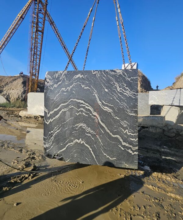 Product Overview: Reliance Titanium Black & Forest Black Granite is a luxurious natural stone celebrated for its striking black background enriched with flowing golden and white veins. Mined from our owned quarry, this granite represents strength, elegance, and timeless beauty — making it a preferred choice for high-end architectural and interior projects across the globe. Each block is a unique creation of nature, offering unmatched character and visual depth. Technical Specifications: Title Reliance Titanium Black & Forest Black Granite Block Stone Type Granite Block Type Gangsaw Block Block Size 300 CM x 180 CM x 180 CM (LXWXH) Color Deep Black with Gold & White Veins Surface Finish Options Wire Saw Cut Density 2960-3000 kg/m3 Compressive Strength 200-250 MPa Water Absorption 0.2%-0.3% Hardness (Mohs) 6 to 7 Porosity Low Origin India Applications Slabs, Countertops, Flooring, Wall Cladding, Interior Key Features: Elegant Aesthetic Appeal: Deep jet-black background enhanced by golden and silver waves — a naturally luxurious look. Superior Strength & Durability: Excellent structural integrity and long-term performance in varied climates. High Polish Retention: Achieves exceptional gloss and mirror-like reflection after finishing. Consistent Texture: Uniform color and grain suitable for large-scale architectural applications. Versatile Application Range: Perfect for multiple interior purposes. Low Maintenance: Resistant to stains, scratches, and moisture, ensuring lasting beauty with minimal upkeep. Export-Grade Blocks: Carefully selected and cut for optimal slab yield and international market standards. Recommended Uses: Kitchen Countertops & Islands Luxury Flooring & Staircases Hotel Lobbies & Reception Areas Wall Cladding & Facades Memorials & Monuments Designer Furniture Tops Why Choose Reliance Titanium Black Granite and Forest Black Granite? Our granite is preferred by export buyers because of: Natural white veins and attractive deep black surface Zero crack, high strength and durability, suitable for projects & reprocessing Consistent Gang Saw block sizes Strict quality checks for each block before shipment Reliable and stable long-term supply Export Capabilities & Payment Terms: We provide smooth, professional export handling with: Payment Options: L/C at sight (Letter of Credit at sight) D/P (Documents Against Payment) T/T advance (if preferred by the buyer) Shipping Documents Provided: Bill of Lading (BL) Commercial Invoice Packing List Certificate of Origin Other documents as per buyer requirements Shipping Price Options: FOB (Indian Port) CNF (any destination port globally) Our logistics team ensures timely loading, documentation, and shipment coordination for a hassle-free experience. About Reliance Mines & Minerals We have a strong presence in the global stone industry, regularly exporting to China, Germany, USA, Oman, and Qatar . Our team is experienced in international trade procedures, ensuring professional communication and smooth cooperation with all partners. We Welcome Your Inquiry If your company is seeking a reliable supplier for premium Titanium black & Forest black granite blocks, we would be pleased to offer quotations, block photos, videos and quarry videos and further details. We look forward to establishing a long-term and successful business relationship with your esteemed company. More About Reliance Titanium Black & Forest Black Granite: Reliance Titanium Black & Forest Black Granite combines natural elegance with engineering excellence. Its bold veins and premium polish bring sophistication to any architectural space, while its robust physical properties ensure durability even in demanding environments. Each block is meticulously extracted and inspected to meet international export quality benchmarks. Reliance Mines & Minerals specializes in the sales and global export of premium granite blocks and slabs. With years of experience in the stone industry, we have established a strong presence in international markets. We are committed to delivering top-quality granite with timely and reliable shipments to major ports worldwide. Our dedicated sales and logistics team is highly skilled in managing export documentation, container loading, and shipping procedures, ensuring a smooth and hassle-free experience for our clients. At the heart of our business is a focus on excellence, professionalism, and customer satisfaction, making us a trusted partner for granite buyers around the globe. 印度 花岗岩 块料 泰坦黑 花岗岩 印度 森林黑 花岗岩 印度 印度 花岗岩 块料, 印度 出口 花岗岩 块, 印度花岗岩原石 中国进口 India granite block Titanium Black granite India Forest Black granite India Granite Blocks Titanium Black Granite Reliance Titanium Black Granite Titanium Black Granite Slabs Polished Titanium Black Granite Bookmatch Titanium Black Granite Titanium Black Granite Exporters India Titanium Black Granite Suppliers Titanium Black Granite Manufacturers Exotic Black Granite with White Veins Deep Black Granite Slabs Mirror Polished Granite Luxury Granite for Interior Walls Natural Stone for Modern Architecture High Gloss Granite Panels Bookmatched Granite Wall Design Black Granite for Hotel Lobby & Flooring Designer Granite Slabs for Projects Indian Granite Exporters Premium Granite from India Granite Slabs for Export Worldwide Granite Supplier Natural Stone Exporter from India Wholesale Granite Supplier Black Granite for Construction & Interiors Architectural Granite Stone Supplier Custom Cut Granite Slabs Export Granite for Wall Cladding Granite for Flooring Granite for Kitchen Countertops Granite for Hotel & Commercial Projects Interior Stone Cladding Luxury Stone for Architects & Designers Black Forest Granite supplier Black Forest Granite manufacturer Black Forest Granite exporter Black Forest Granite quarry Black Forest Granite wholesaler Black Forest Granite seller Buy Black Forest Granite blocks Buy Black Forest Granite slabs Black Forest Granite for flooring Black Forest Granite for countertops Black Forest Granite for wall cladding Black Forest Granite price per sqm Black Forest Granite bulk supplier Black Forest Granite block exporter Black Forest Granite slab manufacturer Black Forest Granite quarry owner Black Forest Granite wholesale price Black Forest Granite large quantity supplier Black Forest Granite custom sizes Black Forest Granite supplier India Black Forest Granite manufacturer India Black Forest Granite exporter India Black Forest Granite quarry India Black Forest Granite supplier [Your City/State] Black Forest Granite international exporter Premium Black Forest Granite supplier Natural Black Forest Granite stone High quality Black Forest Granite slabs Black Forest Granite direct from quarry Black Forest Granite blocks for export Black Forest Granite polished slabs Black granite stone supplier Natural granite stone exporter Indian black granite manufacturer Granite blocks and slabs exporter Dimension stone granite supplier Nebula Wave Granite Stone Manufacturer Export Quality Blocks Supplier Quarry Reliance Mines India Titanium Black Granite Stone Manufacturer Export Quality Blocks Supplier Quarry Reliance Mines India Cosmic Black Granite Stone Manufacturer Export Quality Blocks Supplier Quarry Reliance Mines India Marquina Black Granite Stone Manufacturer Export Quality Blocks Supplier Quarry Reliance Mines India Black Forest Granite Stone Manufacturer Export Quality Blocks Supplier Quarry Reliance Mines India #TitaniumBlackGranite #RelianceGranite #IndianGranite #GraniteExporter #LuxuryGranite #GraniteSupplier #BlackGranite #NaturalStoneIndia #GraniteSlabs #GraniteBookmatch #InteriorDesignStone #ArchitecturalStone #PremiumGranite #GraniteExport #GraniteDesigns #reliancemines #granite #marble #stone #quarry #forestblackgranite
