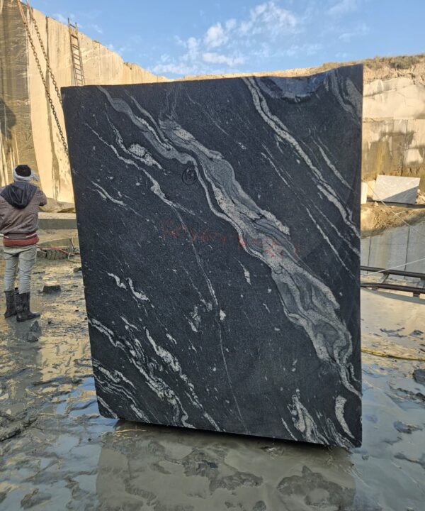 Product Overview: Reliance Titanium Black & Forest Black Granite is a luxurious natural stone celebrated for its striking black background enriched with flowing golden and white veins. Mined from our owned quarry, this granite represents strength, elegance, and timeless beauty — making it a preferred choice for high-end architectural and interior projects across the globe. Each block is a unique creation of nature, offering unmatched character and visual depth. Technical Specifications: Title Reliance Titanium Black & Forest Black Granite Block Stone Type Granite Block Type Gangsaw Block Block Size 300 CM x 180 CM x 180 CM (LXWXH) Color Deep Black with Gold & White Veins Surface Finish Options Wire Saw Cut Density 2960-3000 kg/m3 Compressive Strength 200-250 MPa Water Absorption 0.2%-0.3% Hardness (Mohs) 6 to 7 Porosity Low Origin India Applications Slabs, Countertops, Flooring, Wall Cladding, Interior Key Features: Elegant Aesthetic Appeal: Deep jet-black background enhanced by golden and silver waves — a naturally luxurious look. Superior Strength & Durability: Excellent structural integrity and long-term performance in varied climates. High Polish Retention: Achieves exceptional gloss and mirror-like reflection after finishing. Consistent Texture: Uniform color and grain suitable for large-scale architectural applications. Versatile Application Range: Perfect for multiple interior purposes. Low Maintenance: Resistant to stains, scratches, and moisture, ensuring lasting beauty with minimal upkeep. Export-Grade Blocks: Carefully selected and cut for optimal slab yield and international market standards. Recommended Uses: Kitchen Countertops & Islands Luxury Flooring & Staircases Hotel Lobbies & Reception Areas Wall Cladding & Facades Memorials & Monuments Designer Furniture Tops Why Choose Reliance Titanium Black Granite and Forest Black Granite? Our granite is preferred by export buyers because of: Natural white veins and attractive deep black surface Zero crack, high strength and durability, suitable for projects & reprocessing Consistent Gang Saw block sizes Strict quality checks for each block before shipment Reliable and stable long-term supply Export Capabilities & Payment Terms: We provide smooth, professional export handling with: Payment Options: L/C at sight (Letter of Credit at sight) D/P (Documents Against Payment) T/T advance (if preferred by the buyer) Shipping Documents Provided: Bill of Lading (BL) Commercial Invoice Packing List Certificate of Origin Other documents as per buyer requirements Shipping Price Options: FOB (Indian Port) CNF (any destination port globally) Our logistics team ensures timely loading, documentation, and shipment coordination for a hassle-free experience. About Reliance Mines & Minerals We have a strong presence in the global stone industry, regularly exporting to China, Germany, USA, Oman, and Qatar . Our team is experienced in international trade procedures, ensuring professional communication and smooth cooperation with all partners. We Welcome Your Inquiry If your company is seeking a reliable supplier for premium Titanium black & Forest black granite blocks, we would be pleased to offer quotations, block photos, videos and quarry videos and further details. We look forward to establishing a long-term and successful business relationship with your esteemed company. More About Reliance Titanium Black & Forest Black Granite: Reliance Titanium Black & Forest Black Granite combines natural elegance with engineering excellence. Its bold veins and premium polish bring sophistication to any architectural space, while its robust physical properties ensure durability even in demanding environments. Each block is meticulously extracted and inspected to meet international export quality benchmarks. Reliance Mines & Minerals specializes in the sales and global export of premium granite blocks and slabs. With years of experience in the stone industry, we have established a strong presence in international markets. We are committed to delivering top-quality granite with timely and reliable shipments to major ports worldwide. Our dedicated sales and logistics team is highly skilled in managing export documentation, container loading, and shipping procedures, ensuring a smooth and hassle-free experience for our clients. At the heart of our business is a focus on excellence, professionalism, and customer satisfaction, making us a trusted partner for granite buyers around the globe. 印度 花岗岩 块料 泰坦黑 花岗岩 印度 森林黑 花岗岩 印度 印度 花岗岩 块料, 印度 出口 花岗岩 块, 印度花岗岩原石 中国进口 India granite block Titanium Black granite India Forest Black granite India Granite Blocks Titanium Black Granite Reliance Titanium Black Granite Titanium Black Granite Slabs Polished Titanium Black Granite Bookmatch Titanium Black Granite Titanium Black Granite Exporters India Titanium Black Granite Suppliers Titanium Black Granite Manufacturers Exotic Black Granite with White Veins Deep Black Granite Slabs Mirror Polished Granite Luxury Granite for Interior Walls Natural Stone for Modern Architecture High Gloss Granite Panels Bookmatched Granite Wall Design Black Granite for Hotel Lobby & Flooring Designer Granite Slabs for Projects Indian Granite Exporters Premium Granite from India Granite Slabs for Export Worldwide Granite Supplier Natural Stone Exporter from India Wholesale Granite Supplier Black Granite for Construction & Interiors Architectural Granite Stone Supplier Custom Cut Granite Slabs Export Granite for Wall Cladding Granite for Flooring Granite for Kitchen Countertops Granite for Hotel & Commercial Projects Interior Stone Cladding Luxury Stone for Architects & Designers Black Forest Granite supplier Black Forest Granite manufacturer Black Forest Granite exporter Black Forest Granite quarry Black Forest Granite wholesaler Black Forest Granite seller Buy Black Forest Granite blocks Buy Black Forest Granite slabs Black Forest Granite for flooring Black Forest Granite for countertops Black Forest Granite for wall cladding Black Forest Granite price per sqm Black Forest Granite bulk supplier Black Forest Granite block exporter Black Forest Granite slab manufacturer Black Forest Granite quarry owner Black Forest Granite wholesale price Black Forest Granite large quantity supplier Black Forest Granite custom sizes Black Forest Granite supplier India Black Forest Granite manufacturer India Black Forest Granite exporter India Black Forest Granite quarry India Black Forest Granite supplier [Your City/State] Black Forest Granite international exporter Premium Black Forest Granite supplier Natural Black Forest Granite stone High quality Black Forest Granite slabs Black Forest Granite direct from quarry Black Forest Granite blocks for export Black Forest Granite polished slabs Black granite stone supplier Natural granite stone exporter Indian black granite manufacturer Granite blocks and slabs exporter Dimension stone granite supplier Nebula Wave Granite Stone Manufacturer Export Quality Blocks Supplier Quarry Reliance Mines India Titanium Black Granite Stone Manufacturer Export Quality Blocks Supplier Quarry Reliance Mines India Cosmic Black Granite Stone Manufacturer Export Quality Blocks Supplier Quarry Reliance Mines India Marquina Black Granite Stone Manufacturer Export Quality Blocks Supplier Quarry Reliance Mines India Black Forest Granite Stone Manufacturer Export Quality Blocks Supplier Quarry Reliance Mines India #TitaniumBlackGranite #RelianceGranite #IndianGranite #GraniteExporter #LuxuryGranite #GraniteSupplier #BlackGranite #NaturalStoneIndia #GraniteSlabs #GraniteBookmatch #InteriorDesignStone #ArchitecturalStone #PremiumGranite #GraniteExport #GraniteDesigns #reliancemines #granite #marble #stone #quarry #forestblackgranite