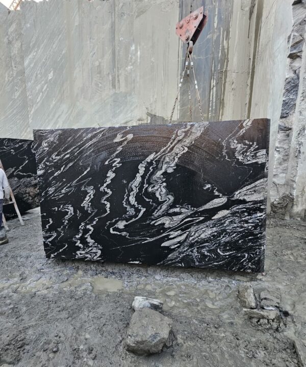 Product Overview: Reliance Titanium Black & Forest Black Granite is a luxurious natural stone celebrated for its striking black background enriched with flowing golden and white veins. Mined from our owned quarry, this granite represents strength, elegance, and timeless beauty — making it a preferred choice for high-end architectural and interior projects across the globe. Each block is a unique creation of nature, offering unmatched character and visual depth. Technical Specifications: Title Reliance Titanium Black & Forest Black Granite Block Stone Type Granite Block Type Gangsaw Block Block Size 300 CM x 180 CM x 180 CM (LXWXH) Color Deep Black with Gold & White Veins Surface Finish Options Wire Saw Cut Density 2960-3000 kg/m3 Compressive Strength 200-250 MPa Water Absorption 0.2%-0.3% Hardness (Mohs) 6 to 7 Porosity Low Origin India Applications Slabs, Countertops, Flooring, Wall Cladding, Interior Key Features: Elegant Aesthetic Appeal: Deep jet-black background enhanced by golden and silver waves — a naturally luxurious look. Superior Strength & Durability: Excellent structural integrity and long-term performance in varied climates. High Polish Retention: Achieves exceptional gloss and mirror-like reflection after finishing. Consistent Texture: Uniform color and grain suitable for large-scale architectural applications. Versatile Application Range: Perfect for multiple interior purposes. Low Maintenance: Resistant to stains, scratches, and moisture, ensuring lasting beauty with minimal upkeep. Export-Grade Blocks: Carefully selected and cut for optimal slab yield and international market standards. Recommended Uses: Kitchen Countertops & Islands Luxury Flooring & Staircases Hotel Lobbies & Reception Areas Wall Cladding & Facades Memorials & Monuments Designer Furniture Tops Why Choose Reliance Titanium Black Granite and Forest Black Granite? Our granite is preferred by export buyers because of: Natural white veins and attractive deep black surface Zero crack, high strength and durability, suitable for projects & reprocessing Consistent Gang Saw block sizes Strict quality checks for each block before shipment Reliable and stable long-term supply Export Capabilities & Payment Terms: We provide smooth, professional export handling with: Payment Options: L/C at sight (Letter of Credit at sight) D/P (Documents Against Payment) T/T advance (if preferred by the buyer) Shipping Documents Provided: Bill of Lading (BL) Commercial Invoice Packing List Certificate of Origin Other documents as per buyer requirements Shipping Price Options: FOB (Indian Port) CNF (any destination port globally) Our logistics team ensures timely loading, documentation, and shipment coordination for a hassle-free experience. About Reliance Mines & Minerals We have a strong presence in the global stone industry, regularly exporting to China, Germany, USA, Oman, and Qatar . Our team is experienced in international trade procedures, ensuring professional communication and smooth cooperation with all partners. We Welcome Your Inquiry If your company is seeking a reliable supplier for premium Titanium black & Forest black granite blocks, we would be pleased to offer quotations, block photos, videos and quarry videos and further details. We look forward to establishing a long-term and successful business relationship with your esteemed company. More About Reliance Titanium Black & Forest Black Granite: Reliance Titanium Black & Forest Black Granite combines natural elegance with engineering excellence. Its bold veins and premium polish bring sophistication to any architectural space, while its robust physical properties ensure durability even in demanding environments. Each block is meticulously extracted and inspected to meet international export quality benchmarks. Reliance Mines & Minerals specializes in the sales and global export of premium granite blocks and slabs. With years of experience in the stone industry, we have established a strong presence in international markets. We are committed to delivering top-quality granite with timely and reliable shipments to major ports worldwide. Our dedicated sales and logistics team is highly skilled in managing export documentation, container loading, and shipping procedures, ensuring a smooth and hassle-free experience for our clients. At the heart of our business is a focus on excellence, professionalism, and customer satisfaction, making us a trusted partner for granite buyers around the globe. 印度 花岗岩 块料 泰坦黑 花岗岩 印度 森林黑 花岗岩 印度 印度 花岗岩 块料, 印度 出口 花岗岩 块, 印度花岗岩原石 中国进口 India granite block Titanium Black granite India Forest Black granite India Granite Blocks Titanium Black Granite Reliance Titanium Black Granite Titanium Black Granite Slabs Polished Titanium Black Granite Bookmatch Titanium Black Granite Titanium Black Granite Exporters India Titanium Black Granite Suppliers Titanium Black Granite Manufacturers Exotic Black Granite with White Veins Deep Black Granite Slabs Mirror Polished Granite Luxury Granite for Interior Walls Natural Stone for Modern Architecture High Gloss Granite Panels Bookmatched Granite Wall Design Black Granite for Hotel Lobby & Flooring Designer Granite Slabs for Projects Indian Granite Exporters Premium Granite from India Granite Slabs for Export Worldwide Granite Supplier Natural Stone Exporter from India Wholesale Granite Supplier Black Granite for Construction & Interiors Architectural Granite Stone Supplier Custom Cut Granite Slabs Export Granite for Wall Cladding Granite for Flooring Granite for Kitchen Countertops Granite for Hotel & Commercial Projects Interior Stone Cladding Luxury Stone for Architects & Designers Black Forest Granite supplier Black Forest Granite manufacturer Black Forest Granite exporter Black Forest Granite quarry Black Forest Granite wholesaler Black Forest Granite seller Buy Black Forest Granite blocks Buy Black Forest Granite slabs Black Forest Granite for flooring Black Forest Granite for countertops Black Forest Granite for wall cladding Black Forest Granite price per sqm Black Forest Granite bulk supplier Black Forest Granite block exporter Black Forest Granite slab manufacturer Black Forest Granite quarry owner Black Forest Granite wholesale price Black Forest Granite large quantity supplier Black Forest Granite custom sizes Black Forest Granite supplier India Black Forest Granite manufacturer India Black Forest Granite exporter India Black Forest Granite quarry India Black Forest Granite supplier [Your City/State] Black Forest Granite international exporter Premium Black Forest Granite supplier Natural Black Forest Granite stone High quality Black Forest Granite slabs Black Forest Granite direct from quarry Black Forest Granite blocks for export Black Forest Granite polished slabs Black granite stone supplier Natural granite stone exporter Indian black granite manufacturer Granite blocks and slabs exporter Dimension stone granite supplier Nebula Wave Granite Stone Manufacturer Export Quality Blocks Supplier Quarry Reliance Mines India Titanium Black Granite Stone Manufacturer Export Quality Blocks Supplier Quarry Reliance Mines India Cosmic Black Granite Stone Manufacturer Export Quality Blocks Supplier Quarry Reliance Mines India Marquina Black Granite Stone Manufacturer Export Quality Blocks Supplier Quarry Reliance Mines India Black Forest Granite Stone Manufacturer Export Quality Blocks Supplier Quarry Reliance Mines India #TitaniumBlackGranite #RelianceGranite #IndianGranite #GraniteExporter #LuxuryGranite #GraniteSupplier #BlackGranite #NaturalStoneIndia #GraniteSlabs #GraniteBookmatch #InteriorDesignStone #ArchitecturalStone #PremiumGranite #GraniteExport #GraniteDesigns #reliancemines #granite #marble #stone #quarry #forestblackgranite