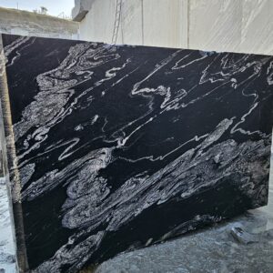 Product Overview: Reliance Titanium Black & Forest Black Granite is a luxurious natural stone celebrated for its striking black background enriched with flowing golden and white veins. Mined from our owned quarry, this granite represents strength, elegance, and timeless beauty — making it a preferred choice for high-end architectural and interior projects across the globe. Each block is a unique creation of nature, offering unmatched character and visual depth. Technical Specifications: Title Reliance Titanium Black & Forest Black Granite Block Stone Type Granite Block Type Gangsaw Block Block Size 300 CM x 180 CM x 180 CM (LXWXH) Color Deep Black with Gold & White Veins Surface Finish Options Wire Saw Cut Density 2960-3000 kg/m3 Compressive Strength 200-250 MPa Water Absorption 0.2%-0.3% Hardness (Mohs) 6 to 7 Porosity Low Origin India Applications Slabs, Countertops, Flooring, Wall Cladding, Interior Key Features: Elegant Aesthetic Appeal: Deep jet-black background enhanced by golden and silver waves — a naturally luxurious look. Superior Strength & Durability: Excellent structural integrity and long-term performance in varied climates. High Polish Retention: Achieves exceptional gloss and mirror-like reflection after finishing. Consistent Texture: Uniform color and grain suitable for large-scale architectural applications. Versatile Application Range: Perfect for multiple interior purposes. Low Maintenance: Resistant to stains, scratches, and moisture, ensuring lasting beauty with minimal upkeep. Export-Grade Blocks: Carefully selected and cut for optimal slab yield and international market standards. Recommended Uses: Kitchen Countertops & Islands Luxury Flooring & Staircases Hotel Lobbies & Reception Areas Wall Cladding & Facades Memorials & Monuments Designer Furniture Tops Why Choose Reliance Titanium Black Granite and Forest Black Granite? Our granite is preferred by export buyers because of: Natural white veins and attractive deep black surface Zero crack, high strength and durability, suitable for projects & reprocessing Consistent Gang Saw block sizes Strict quality checks for each block before shipment Reliable and stable long-term supply Export Capabilities & Payment Terms: We provide smooth, professional export handling with: Payment Options: L/C at sight (Letter of Credit at sight) D/P (Documents Against Payment) T/T advance (if preferred by the buyer) Shipping Documents Provided: Bill of Lading (BL) Commercial Invoice Packing List Certificate of Origin Other documents as per buyer requirements Shipping Price Options: FOB (Indian Port) CNF (any destination port globally) Our logistics team ensures timely loading, documentation, and shipment coordination for a hassle-free experience. About Reliance Mines & Minerals We have a strong presence in the global stone industry, regularly exporting to China, Germany, USA, Oman, and Qatar . Our team is experienced in international trade procedures, ensuring professional communication and smooth cooperation with all partners. We Welcome Your Inquiry If your company is seeking a reliable supplier for premium Titanium black & Forest black granite blocks, we would be pleased to offer quotations, block photos, videos and quarry videos and further details. We look forward to establishing a long-term and successful business relationship with your esteemed company. More About Reliance Titanium Black & Forest Black Granite: Reliance Titanium Black & Forest Black Granite combines natural elegance with engineering excellence. Its bold veins and premium polish bring sophistication to any architectural space, while its robust physical properties ensure durability even in demanding environments. Each block is meticulously extracted and inspected to meet international export quality benchmarks. Reliance Mines & Minerals specializes in the sales and global export of premium granite blocks and slabs. With years of experience in the stone industry, we have established a strong presence in international markets. We are committed to delivering top-quality granite with timely and reliable shipments to major ports worldwide. Our dedicated sales and logistics team is highly skilled in managing export documentation, container loading, and shipping procedures, ensuring a smooth and hassle-free experience for our clients. At the heart of our business is a focus on excellence, professionalism, and customer satisfaction, making us a trusted partner for granite buyers around the globe. 印度 花岗岩 块料 泰坦黑 花岗岩 印度 森林黑 花岗岩 印度 印度 花岗岩 块料, 印度 出口 花岗岩 块, 印度花岗岩原石 中国进口 India granite block Titanium Black granite India Forest Black granite India Granite Blocks Titanium Black Granite Reliance Titanium Black Granite Titanium Black Granite Slabs Polished Titanium Black Granite Bookmatch Titanium Black Granite Titanium Black Granite Exporters India Titanium Black Granite Suppliers Titanium Black Granite Manufacturers Exotic Black Granite with White Veins Deep Black Granite Slabs Mirror Polished Granite Luxury Granite for Interior Walls Natural Stone for Modern Architecture High Gloss Granite Panels Bookmatched Granite Wall Design Black Granite for Hotel Lobby & Flooring Designer Granite Slabs for Projects Indian Granite Exporters Premium Granite from India Granite Slabs for Export Worldwide Granite Supplier Natural Stone Exporter from India Wholesale Granite Supplier Black Granite for Construction & Interiors Architectural Granite Stone Supplier Custom Cut Granite Slabs Export Granite for Wall Cladding Granite for Flooring Granite for Kitchen Countertops Granite for Hotel & Commercial Projects Interior Stone Cladding Luxury Stone for Architects & Designers Black Forest Granite supplier Black Forest Granite manufacturer Black Forest Granite exporter Black Forest Granite quarry Black Forest Granite wholesaler Black Forest Granite seller Buy Black Forest Granite blocks Buy Black Forest Granite slabs Black Forest Granite for flooring Black Forest Granite for countertops Black Forest Granite for wall cladding Black Forest Granite price per sqm Black Forest Granite bulk supplier Black Forest Granite block exporter Black Forest Granite slab manufacturer Black Forest Granite quarry owner Black Forest Granite wholesale price Black Forest Granite large quantity supplier Black Forest Granite custom sizes Black Forest Granite supplier India Black Forest Granite manufacturer India Black Forest Granite exporter India Black Forest Granite quarry India Black Forest Granite supplier [Your City/State] Black Forest Granite international exporter Premium Black Forest Granite supplier Natural Black Forest Granite stone High quality Black Forest Granite slabs Black Forest Granite direct from quarry Black Forest Granite blocks for export Black Forest Granite polished slabs Black granite stone supplier Natural granite stone exporter Indian black granite manufacturer Granite blocks and slabs exporter Dimension stone granite supplier Nebula Wave Granite Stone Manufacturer Export Quality Blocks Supplier Quarry Reliance Mines India Titanium Black Granite Stone Manufacturer Export Quality Blocks Supplier Quarry Reliance Mines India Cosmic Black Granite Stone Manufacturer Export Quality Blocks Supplier Quarry Reliance Mines India Marquina Black Granite Stone Manufacturer Export Quality Blocks Supplier Quarry Reliance Mines India Black Forest Granite Stone Manufacturer Export Quality Blocks Supplier Quarry Reliance Mines India #TitaniumBlackGranite #RelianceGranite #IndianGranite #GraniteExporter #LuxuryGranite #GraniteSupplier #BlackGranite #NaturalStoneIndia #GraniteSlabs #GraniteBookmatch #InteriorDesignStone #ArchitecturalStone #PremiumGranite #GraniteExport #GraniteDesigns #reliancemines #granite #marble #stone #quarry #forestblackgranite
