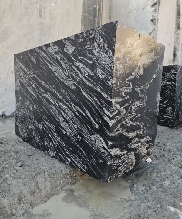 Product Overview: Reliance Titanium Black & Forest Black Granite is a luxurious natural stone celebrated for its striking black background enriched with flowing golden and white veins. Mined from our owned quarry, this granite represents strength, elegance, and timeless beauty — making it a preferred choice for high-end architectural and interior projects across the globe. Each block is a unique creation of nature, offering unmatched character and visual depth. Technical Specifications: Title Reliance Titanium Black & Forest Black Granite Block Stone Type Granite Block Type Gangsaw Block Block Size 300 CM x 180 CM x 180 CM (LXWXH) Color Deep Black with Gold & White Veins Surface Finish Options Wire Saw Cut Density 2960-3000 kg/m3 Compressive Strength 200-250 MPa Water Absorption 0.2%-0.3% Hardness (Mohs) 6 to 7 Porosity Low Origin India Applications Slabs, Countertops, Flooring, Wall Cladding, Interior Key Features: Elegant Aesthetic Appeal: Deep jet-black background enhanced by golden and silver waves — a naturally luxurious look. Superior Strength & Durability: Excellent structural integrity and long-term performance in varied climates. High Polish Retention: Achieves exceptional gloss and mirror-like reflection after finishing. Consistent Texture: Uniform color and grain suitable for large-scale architectural applications. Versatile Application Range: Perfect for multiple interior purposes. Low Maintenance: Resistant to stains, scratches, and moisture, ensuring lasting beauty with minimal upkeep. Export-Grade Blocks: Carefully selected and cut for optimal slab yield and international market standards. Recommended Uses: Kitchen Countertops & Islands Luxury Flooring & Staircases Hotel Lobbies & Reception Areas Wall Cladding & Facades Memorials & Monuments Designer Furniture Tops Why Choose Reliance Titanium Black Granite and Forest Black Granite? Our granite is preferred by export buyers because of: Natural white veins and attractive deep black surface Zero crack, high strength and durability, suitable for projects & reprocessing Consistent Gang Saw block sizes Strict quality checks for each block before shipment Reliable and stable long-term supply Export Capabilities & Payment Terms: We provide smooth, professional export handling with: Payment Options: L/C at sight (Letter of Credit at sight) D/P (Documents Against Payment) T/T advance (if preferred by the buyer) Shipping Documents Provided: Bill of Lading (BL) Commercial Invoice Packing List Certificate of Origin Other documents as per buyer requirements Shipping Price Options: FOB (Indian Port) CNF (any destination port globally) Our logistics team ensures timely loading, documentation, and shipment coordination for a hassle-free experience. About Reliance Mines & Minerals We have a strong presence in the global stone industry, regularly exporting to China, Germany, USA, Oman, and Qatar . Our team is experienced in international trade procedures, ensuring professional communication and smooth cooperation with all partners. We Welcome Your Inquiry If your company is seeking a reliable supplier for premium Titanium black & Forest black granite blocks, we would be pleased to offer quotations, block photos, videos and quarry videos and further details. We look forward to establishing a long-term and successful business relationship with your esteemed company. More About Reliance Titanium Black & Forest Black Granite: Reliance Titanium Black & Forest Black Granite combines natural elegance with engineering excellence. Its bold veins and premium polish bring sophistication to any architectural space, while its robust physical properties ensure durability even in demanding environments. Each block is meticulously extracted and inspected to meet international export quality benchmarks. Reliance Mines & Minerals specializes in the sales and global export of premium granite blocks and slabs. With years of experience in the stone industry, we have established a strong presence in international markets. We are committed to delivering top-quality granite with timely and reliable shipments to major ports worldwide. Our dedicated sales and logistics team is highly skilled in managing export documentation, container loading, and shipping procedures, ensuring a smooth and hassle-free experience for our clients. At the heart of our business is a focus on excellence, professionalism, and customer satisfaction, making us a trusted partner for granite buyers around the globe. 印度 花岗岩 块料 泰坦黑 花岗岩 印度 森林黑 花岗岩 印度 印度 花岗岩 块料, 印度 出口 花岗岩 块, 印度花岗岩原石 中国进口 India granite block Titanium Black granite India Forest Black granite India Granite Blocks Titanium Black Granite Reliance Titanium Black Granite Titanium Black Granite Slabs Polished Titanium Black Granite Bookmatch Titanium Black Granite Titanium Black Granite Exporters India Titanium Black Granite Suppliers Titanium Black Granite Manufacturers Exotic Black Granite with White Veins Deep Black Granite Slabs Mirror Polished Granite Luxury Granite for Interior Walls Natural Stone for Modern Architecture High Gloss Granite Panels Bookmatched Granite Wall Design Black Granite for Hotel Lobby & Flooring Designer Granite Slabs for Projects Indian Granite Exporters Premium Granite from India Granite Slabs for Export Worldwide Granite Supplier Natural Stone Exporter from India Wholesale Granite Supplier Black Granite for Construction & Interiors Architectural Granite Stone Supplier Custom Cut Granite Slabs Export Granite for Wall Cladding Granite for Flooring Granite for Kitchen Countertops Granite for Hotel & Commercial Projects Interior Stone Cladding Luxury Stone for Architects & Designers Black Forest Granite supplier Black Forest Granite manufacturer Black Forest Granite exporter Black Forest Granite quarry Black Forest Granite wholesaler Black Forest Granite seller Buy Black Forest Granite blocks Buy Black Forest Granite slabs Black Forest Granite for flooring Black Forest Granite for countertops Black Forest Granite for wall cladding Black Forest Granite price per sqm Black Forest Granite bulk supplier Black Forest Granite block exporter Black Forest Granite slab manufacturer Black Forest Granite quarry owner Black Forest Granite wholesale price Black Forest Granite large quantity supplier Black Forest Granite custom sizes Black Forest Granite supplier India Black Forest Granite manufacturer India Black Forest Granite exporter India Black Forest Granite quarry India Black Forest Granite supplier [Your City/State] Black Forest Granite international exporter Premium Black Forest Granite supplier Natural Black Forest Granite stone High quality Black Forest Granite slabs Black Forest Granite direct from quarry Black Forest Granite blocks for export Black Forest Granite polished slabs Black granite stone supplier Natural granite stone exporter Indian black granite manufacturer Granite blocks and slabs exporter Dimension stone granite supplier Nebula Wave Granite Stone Manufacturer Export Quality Blocks Supplier Quarry Reliance Mines India Titanium Black Granite Stone Manufacturer Export Quality Blocks Supplier Quarry Reliance Mines India Cosmic Black Granite Stone Manufacturer Export Quality Blocks Supplier Quarry Reliance Mines India Marquina Black Granite Stone Manufacturer Export Quality Blocks Supplier Quarry Reliance Mines India Black Forest Granite Stone Manufacturer Export Quality Blocks Supplier Quarry Reliance Mines India #TitaniumBlackGranite #RelianceGranite #IndianGranite #GraniteExporter #LuxuryGranite #GraniteSupplier #BlackGranite #NaturalStoneIndia #GraniteSlabs #GraniteBookmatch #InteriorDesignStone #ArchitecturalStone #PremiumGranite #GraniteExport #GraniteDesigns #reliancemines #granite #marble #stone #quarry #forestblackgranite