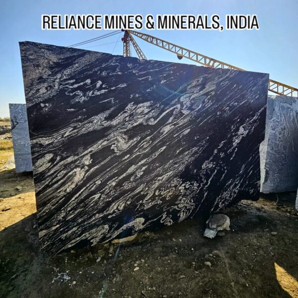 Product Overview: Reliance Titanium Black & Forest Black Granite is a luxurious natural stone celebrated for its striking black background enriched with flowing golden and white veins. Mined from our owned quarry, this granite represents strength, elegance, and timeless beauty — making it a preferred choice for high-end architectural and interior projects across the globe. Each block is a unique creation of nature, offering unmatched character and visual depth. Technical Specifications: Title Reliance Titanium Black & Forest Black Granite Block Stone Type Granite Block Type Gangsaw Block Block Size 300 CM x 180 CM x 180 CM (LXWXH) Color Deep Black with Gold & White Veins Surface Finish Options Wire Saw Cut Density 2960-3000 kg/m3 Compressive Strength 200-250 MPa Water Absorption 0.2%-0.3% Hardness (Mohs) 6 to 7 Porosity Low Origin India Applications Slabs, Countertops, Flooring, Wall Cladding, Interior Key Features: Elegant Aesthetic Appeal: Deep jet-black background enhanced by golden and silver waves — a naturally luxurious look. Superior Strength & Durability: Excellent structural integrity and long-term performance in varied climates. High Polish Retention: Achieves exceptional gloss and mirror-like reflection after finishing. Consistent Texture: Uniform color and grain suitable for large-scale architectural applications. Versatile Application Range: Perfect for multiple interior purposes. Low Maintenance: Resistant to stains, scratches, and moisture, ensuring lasting beauty with minimal upkeep. Export-Grade Blocks: Carefully selected and cut for optimal slab yield and international market standards. Recommended Uses: Kitchen Countertops & Islands Luxury Flooring & Staircases Hotel Lobbies & Reception Areas Wall Cladding & Facades Memorials & Monuments Designer Furniture Tops Why Choose Reliance Titanium Black Granite and Forest Black Granite? Our granite is preferred by export buyers because of: Natural white veins and attractive deep black surface Zero crack, high strength and durability, suitable for projects & reprocessing Consistent Gang Saw block sizes Strict quality checks for each block before shipment Reliable and stable long-term supply Export Capabilities & Payment Terms: We provide smooth, professional export handling with: Payment Options: L/C at sight (Letter of Credit at sight) D/P (Documents Against Payment) T/T advance (if preferred by the buyer) Shipping Documents Provided: Bill of Lading (BL) Commercial Invoice Packing List Certificate of Origin Other documents as per buyer requirements Shipping Price Options: FOB (Indian Port) CNF (any destination port globally) Our logistics team ensures timely loading, documentation, and shipment coordination for a hassle-free experience. About Reliance Mines & Minerals We have a strong presence in the global stone industry, regularly exporting to China, Germany, USA, Oman, and Qatar . Our team is experienced in international trade procedures, ensuring professional communication and smooth cooperation with all partners. We Welcome Your Inquiry If your company is seeking a reliable supplier for premium Titanium black & Forest black granite blocks, we would be pleased to offer quotations, block photos, videos and quarry videos and further details. We look forward to establishing a long-term and successful business relationship with your esteemed company. More About Reliance Titanium Black & Forest Black Granite: Reliance Titanium Black & Forest Black Granite combines natural elegance with engineering excellence. Its bold veins and premium polish bring sophistication to any architectural space, while its robust physical properties ensure durability even in demanding environments. Each block is meticulously extracted and inspected to meet international export quality benchmarks. Reliance Mines & Minerals specializes in the sales and global export of premium granite blocks and slabs. With years of experience in the stone industry, we have established a strong presence in international markets. We are committed to delivering top-quality granite with timely and reliable shipments to major ports worldwide. Our dedicated sales and logistics team is highly skilled in managing export documentation, container loading, and shipping procedures, ensuring a smooth and hassle-free experience for our clients. At the heart of our business is a focus on excellence, professionalism, and customer satisfaction, making us a trusted partner for granite buyers around the globe. 印度 花岗岩 块料 泰坦黑 花岗岩 印度 森林黑 花岗岩 印度 印度 花岗岩 块料, 印度 出口 花岗岩 块, 印度花岗岩原石 中国进口 India granite block Titanium Black granite India Forest Black granite India Granite Blocks Titanium Black Granite Reliance Titanium Black Granite Titanium Black Granite Slabs Polished Titanium Black Granite Bookmatch Titanium Black Granite Titanium Black Granite Exporters India Titanium Black Granite Suppliers Titanium Black Granite Manufacturers Exotic Black Granite with White Veins Deep Black Granite Slabs Mirror Polished Granite Luxury Granite for Interior Walls Natural Stone for Modern Architecture High Gloss Granite Panels Bookmatched Granite Wall Design Black Granite for Hotel Lobby & Flooring Designer Granite Slabs for Projects Indian Granite Exporters Premium Granite from India Granite Slabs for Export Worldwide Granite Supplier Natural Stone Exporter from India Wholesale Granite Supplier Black Granite for Construction & Interiors Architectural Granite Stone Supplier Custom Cut Granite Slabs Export Granite for Wall Cladding Granite for Flooring Granite for Kitchen Countertops Granite for Hotel & Commercial Projects Interior Stone Cladding Luxury Stone for Architects & Designers Black Forest Granite supplier Black Forest Granite manufacturer Black Forest Granite exporter Black Forest Granite quarry Black Forest Granite wholesaler Black Forest Granite seller Buy Black Forest Granite blocks Buy Black Forest Granite slabs Black Forest Granite for flooring Black Forest Granite for countertops Black Forest Granite for wall cladding Black Forest Granite price per sqm Black Forest Granite bulk supplier Black Forest Granite block exporter Black Forest Granite slab manufacturer Black Forest Granite quarry owner Black Forest Granite wholesale price Black Forest Granite large quantity supplier Black Forest Granite custom sizes Black Forest Granite supplier India Black Forest Granite manufacturer India Black Forest Granite exporter India Black Forest Granite quarry India Black Forest Granite supplier [Your City/State] Black Forest Granite international exporter Premium Black Forest Granite supplier Natural Black Forest Granite stone High quality Black Forest Granite slabs Black Forest Granite direct from quarry Black Forest Granite blocks for export Black Forest Granite polished slabs Black granite stone supplier Natural granite stone exporter Indian black granite manufacturer Granite blocks and slabs exporter Dimension stone granite supplier Nebula Wave Granite Stone Manufacturer Export Quality Blocks Supplier Quarry Reliance Mines India Titanium Black Granite Stone Manufacturer Export Quality Blocks Supplier Quarry Reliance Mines India Cosmic Black Granite Stone Manufacturer Export Quality Blocks Supplier Quarry Reliance Mines India Marquina Black Granite Stone Manufacturer Export Quality Blocks Supplier Quarry Reliance Mines India Black Forest Granite Stone Manufacturer Export Quality Blocks Supplier Quarry Reliance Mines India #TitaniumBlackGranite #RelianceGranite #IndianGranite #GraniteExporter #LuxuryGranite #GraniteSupplier #BlackGranite #NaturalStoneIndia #GraniteSlabs #GraniteBookmatch #InteriorDesignStone #ArchitecturalStone #PremiumGranite #GraniteExport #GraniteDesigns #reliancemines #granite #marble #stone #quarry #forestblackgranite