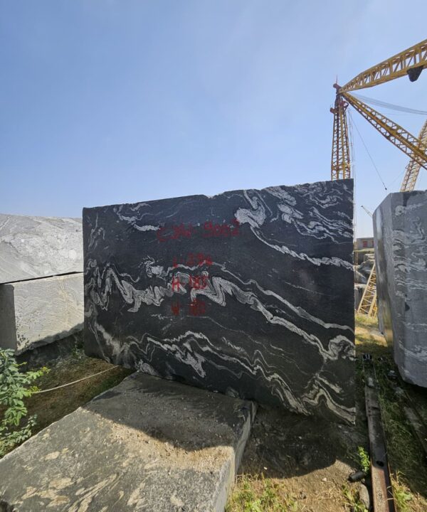 Product Overview: Reliance Titanium Black & Forest Black Granite is a luxurious natural stone celebrated for its striking black background enriched with flowing golden and white veins. Mined from our owned quarry, this granite represents strength, elegance, and timeless beauty — making it a preferred choice for high-end architectural and interior projects across the globe. Each block is a unique creation of nature, offering unmatched character and visual depth. Technical Specifications: Title Reliance Titanium Black & Forest Black Granite Block Stone Type Granite Block Type Gangsaw Block Block Size 300 CM x 180 CM x 180 CM (LXWXH) Color Deep Black with Gold & White Veins Surface Finish Options Wire Saw Cut Density 2960-3000 kg/m3 Compressive Strength 200-250 MPa Water Absorption 0.2%-0.3% Hardness (Mohs) 6 to 7 Porosity Low Origin India Applications Slabs, Countertops, Flooring, Wall Cladding, Interior Key Features: Elegant Aesthetic Appeal: Deep jet-black background enhanced by golden and silver waves — a naturally luxurious look. Superior Strength & Durability: Excellent structural integrity and long-term performance in varied climates. High Polish Retention: Achieves exceptional gloss and mirror-like reflection after finishing. Consistent Texture: Uniform color and grain suitable for large-scale architectural applications. Versatile Application Range: Perfect for multiple interior purposes. Low Maintenance: Resistant to stains, scratches, and moisture, ensuring lasting beauty with minimal upkeep. Export-Grade Blocks: Carefully selected and cut for optimal slab yield and international market standards. Recommended Uses: Kitchen Countertops & Islands Luxury Flooring & Staircases Hotel Lobbies & Reception Areas Wall Cladding & Facades Memorials & Monuments Designer Furniture Tops Why Choose Reliance Titanium Black Granite and Forest Black Granite? Our granite is preferred by export buyers because of: Natural white veins and attractive deep black surface Zero crack, high strength and durability, suitable for projects & reprocessing Consistent Gang Saw block sizes Strict quality checks for each block before shipment Reliable and stable long-term supply Export Capabilities & Payment Terms: We provide smooth, professional export handling with: Payment Options: L/C at sight (Letter of Credit at sight) D/P (Documents Against Payment) T/T advance (if preferred by the buyer) Shipping Documents Provided: Bill of Lading (BL) Commercial Invoice Packing List Certificate of Origin Other documents as per buyer requirements Shipping Price Options: FOB (Indian Port) CNF (any destination port globally) Our logistics team ensures timely loading, documentation, and shipment coordination for a hassle-free experience. About Reliance Mines & Minerals We have a strong presence in the global stone industry, regularly exporting to China, Germany, USA, Oman, and Qatar . Our team is experienced in international trade procedures, ensuring professional communication and smooth cooperation with all partners. We Welcome Your Inquiry If your company is seeking a reliable supplier for premium Titanium black & Forest black granite blocks, we would be pleased to offer quotations, block photos, videos and quarry videos and further details. We look forward to establishing a long-term and successful business relationship with your esteemed company. More About Reliance Titanium Black & Forest Black Granite: Reliance Titanium Black & Forest Black Granite combines natural elegance with engineering excellence. Its bold veins and premium polish bring sophistication to any architectural space, while its robust physical properties ensure durability even in demanding environments. Each block is meticulously extracted and inspected to meet international export quality benchmarks. Reliance Mines & Minerals specializes in the sales and global export of premium granite blocks and slabs. With years of experience in the stone industry, we have established a strong presence in international markets. We are committed to delivering top-quality granite with timely and reliable shipments to major ports worldwide. Our dedicated sales and logistics team is highly skilled in managing export documentation, container loading, and shipping procedures, ensuring a smooth and hassle-free experience for our clients. At the heart of our business is a focus on excellence, professionalism, and customer satisfaction, making us a trusted partner for granite buyers around the globe. 印度 花岗岩 块料 泰坦黑 花岗岩 印度 森林黑 花岗岩 印度 印度 花岗岩 块料, 印度 出口 花岗岩 块, 印度花岗岩原石 中国进口 India granite block Titanium Black granite India Forest Black granite India Granite Blocks Titanium Black Granite Reliance Titanium Black Granite Titanium Black Granite Slabs Polished Titanium Black Granite Bookmatch Titanium Black Granite Titanium Black Granite Exporters India Titanium Black Granite Suppliers Titanium Black Granite Manufacturers Exotic Black Granite with White Veins Deep Black Granite Slabs Mirror Polished Granite Luxury Granite for Interior Walls Natural Stone for Modern Architecture High Gloss Granite Panels Bookmatched Granite Wall Design Black Granite for Hotel Lobby & Flooring Designer Granite Slabs for Projects Indian Granite Exporters Premium Granite from India Granite Slabs for Export Worldwide Granite Supplier Natural Stone Exporter from India Wholesale Granite Supplier Black Granite for Construction & Interiors Architectural Granite Stone Supplier Custom Cut Granite Slabs Export Granite for Wall Cladding Granite for Flooring Granite for Kitchen Countertops Granite for Hotel & Commercial Projects Interior Stone Cladding Luxury Stone for Architects & Designers Black Forest Granite supplier Black Forest Granite manufacturer Black Forest Granite exporter Black Forest Granite quarry Black Forest Granite wholesaler Black Forest Granite seller Buy Black Forest Granite blocks Buy Black Forest Granite slabs Black Forest Granite for flooring Black Forest Granite for countertops Black Forest Granite for wall cladding Black Forest Granite price per sqm Black Forest Granite bulk supplier Black Forest Granite block exporter Black Forest Granite slab manufacturer Black Forest Granite quarry owner Black Forest Granite wholesale price Black Forest Granite large quantity supplier Black Forest Granite custom sizes Black Forest Granite supplier India Black Forest Granite manufacturer India Black Forest Granite exporter India Black Forest Granite quarry India Black Forest Granite supplier [Your City/State] Black Forest Granite international exporter Premium Black Forest Granite supplier Natural Black Forest Granite stone High quality Black Forest Granite slabs Black Forest Granite direct from quarry Black Forest Granite blocks for export Black Forest Granite polished slabs Black granite stone supplier Natural granite stone exporter Indian black granite manufacturer Granite blocks and slabs exporter Dimension stone granite supplier Nebula Wave Granite Stone Manufacturer Export Quality Blocks Supplier Quarry Reliance Mines India Titanium Black Granite Stone Manufacturer Export Quality Blocks Supplier Quarry Reliance Mines India Cosmic Black Granite Stone Manufacturer Export Quality Blocks Supplier Quarry Reliance Mines India Marquina Black Granite Stone Manufacturer Export Quality Blocks Supplier Quarry Reliance Mines India Black Forest Granite Stone Manufacturer Export Quality Blocks Supplier Quarry Reliance Mines India #TitaniumBlackGranite #RelianceGranite #IndianGranite #GraniteExporter #LuxuryGranite #GraniteSupplier #BlackGranite #NaturalStoneIndia #GraniteSlabs #GraniteBookmatch #InteriorDesignStone #ArchitecturalStone #PremiumGranite #GraniteExport #GraniteDesigns #reliancemines #granite #marble #stone #quarry #forestblackgranite