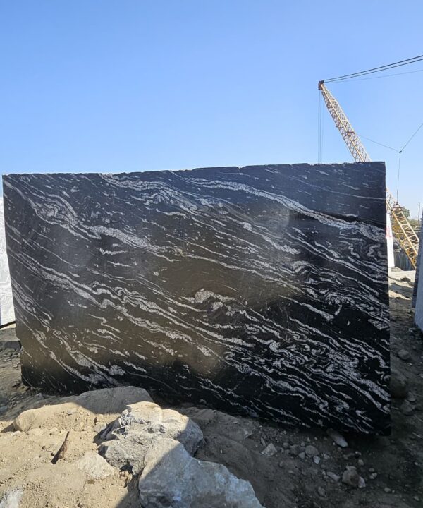 Product Overview: Reliance Titanium Black & Forest Black Granite is a luxurious natural stone celebrated for its striking black background enriched with flowing golden and white veins. Mined from our owned quarry, this granite represents strength, elegance, and timeless beauty — making it a preferred choice for high-end architectural and interior projects across the globe. Each block is a unique creation of nature, offering unmatched character and visual depth. Technical Specifications: Title Reliance Titanium Black & Forest Black Granite Block Stone Type Granite Block Type Gangsaw Block Block Size 300 CM x 180 CM x 180 CM (LXWXH) Color Deep Black with Gold & White Veins Surface Finish Options Wire Saw Cut Density 2960-3000 kg/m3 Compressive Strength 200-250 MPa Water Absorption 0.2%-0.3% Hardness (Mohs) 6 to 7 Porosity Low Origin India Applications Slabs, Countertops, Flooring, Wall Cladding, Interior Key Features: Elegant Aesthetic Appeal: Deep jet-black background enhanced by golden and silver waves — a naturally luxurious look. Superior Strength & Durability: Excellent structural integrity and long-term performance in varied climates. High Polish Retention: Achieves exceptional gloss and mirror-like reflection after finishing. Consistent Texture: Uniform color and grain suitable for large-scale architectural applications. Versatile Application Range: Perfect for multiple interior purposes. Low Maintenance: Resistant to stains, scratches, and moisture, ensuring lasting beauty with minimal upkeep. Export-Grade Blocks: Carefully selected and cut for optimal slab yield and international market standards. Recommended Uses: Kitchen Countertops & Islands Luxury Flooring & Staircases Hotel Lobbies & Reception Areas Wall Cladding & Facades Memorials & Monuments Designer Furniture Tops Why Choose Reliance Titanium Black Granite and Forest Black Granite? Our granite is preferred by export buyers because of: Natural white veins and attractive deep black surface Zero crack, high strength and durability, suitable for projects & reprocessing Consistent Gang Saw block sizes Strict quality checks for each block before shipment Reliable and stable long-term supply Export Capabilities & Payment Terms: We provide smooth, professional export handling with: Payment Options: L/C at sight (Letter of Credit at sight) D/P (Documents Against Payment) T/T advance (if preferred by the buyer) Shipping Documents Provided: Bill of Lading (BL) Commercial Invoice Packing List Certificate of Origin Other documents as per buyer requirements Shipping Price Options: FOB (Indian Port) CNF (any destination port globally) Our logistics team ensures timely loading, documentation, and shipment coordination for a hassle-free experience. About Reliance Mines & Minerals We have a strong presence in the global stone industry, regularly exporting to China, Germany, USA, Oman, and Qatar . Our team is experienced in international trade procedures, ensuring professional communication and smooth cooperation with all partners. We Welcome Your Inquiry If your company is seeking a reliable supplier for premium Titanium black & Forest black granite blocks, we would be pleased to offer quotations, block photos, videos and quarry videos and further details. We look forward to establishing a long-term and successful business relationship with your esteemed company. More About Reliance Titanium Black & Forest Black Granite: Reliance Titanium Black & Forest Black Granite combines natural elegance with engineering excellence. Its bold veins and premium polish bring sophistication to any architectural space, while its robust physical properties ensure durability even in demanding environments. Each block is meticulously extracted and inspected to meet international export quality benchmarks. Reliance Mines & Minerals specializes in the sales and global export of premium granite blocks and slabs. With years of experience in the stone industry, we have established a strong presence in international markets. We are committed to delivering top-quality granite with timely and reliable shipments to major ports worldwide. Our dedicated sales and logistics team is highly skilled in managing export documentation, container loading, and shipping procedures, ensuring a smooth and hassle-free experience for our clients. At the heart of our business is a focus on excellence, professionalism, and customer satisfaction, making us a trusted partner for granite buyers around the globe. 印度 花岗岩 块料 泰坦黑 花岗岩 印度 森林黑 花岗岩 印度 印度 花岗岩 块料, 印度 出口 花岗岩 块, 印度花岗岩原石 中国进口 India granite block Titanium Black granite India Forest Black granite India Granite Blocks Titanium Black Granite Reliance Titanium Black Granite Titanium Black Granite Slabs Polished Titanium Black Granite Bookmatch Titanium Black Granite Titanium Black Granite Exporters India Titanium Black Granite Suppliers Titanium Black Granite Manufacturers Exotic Black Granite with White Veins Deep Black Granite Slabs Mirror Polished Granite Luxury Granite for Interior Walls Natural Stone for Modern Architecture High Gloss Granite Panels Bookmatched Granite Wall Design Black Granite for Hotel Lobby & Flooring Designer Granite Slabs for Projects Indian Granite Exporters Premium Granite from India Granite Slabs for Export Worldwide Granite Supplier Natural Stone Exporter from India Wholesale Granite Supplier Black Granite for Construction & Interiors Architectural Granite Stone Supplier Custom Cut Granite Slabs Export Granite for Wall Cladding Granite for Flooring Granite for Kitchen Countertops Granite for Hotel & Commercial Projects Interior Stone Cladding Luxury Stone for Architects & Designers Black Forest Granite supplier Black Forest Granite manufacturer Black Forest Granite exporter Black Forest Granite quarry Black Forest Granite wholesaler Black Forest Granite seller Buy Black Forest Granite blocks Buy Black Forest Granite slabs Black Forest Granite for flooring Black Forest Granite for countertops Black Forest Granite for wall cladding Black Forest Granite price per sqm Black Forest Granite bulk supplier Black Forest Granite block exporter Black Forest Granite slab manufacturer Black Forest Granite quarry owner Black Forest Granite wholesale price Black Forest Granite large quantity supplier Black Forest Granite custom sizes Black Forest Granite supplier India Black Forest Granite manufacturer India Black Forest Granite exporter India Black Forest Granite quarry India Black Forest Granite supplier [Your City/State] Black Forest Granite international exporter Premium Black Forest Granite supplier Natural Black Forest Granite stone High quality Black Forest Granite slabs Black Forest Granite direct from quarry Black Forest Granite blocks for export Black Forest Granite polished slabs Black granite stone supplier Natural granite stone exporter Indian black granite manufacturer Granite blocks and slabs exporter Dimension stone granite supplier Nebula Wave Granite Stone Manufacturer Export Quality Blocks Supplier Quarry Reliance Mines India Titanium Black Granite Stone Manufacturer Export Quality Blocks Supplier Quarry Reliance Mines India Cosmic Black Granite Stone Manufacturer Export Quality Blocks Supplier Quarry Reliance Mines India Marquina Black Granite Stone Manufacturer Export Quality Blocks Supplier Quarry Reliance Mines India Black Forest Granite Stone Manufacturer Export Quality Blocks Supplier Quarry Reliance Mines India #TitaniumBlackGranite #RelianceGranite #IndianGranite #GraniteExporter #LuxuryGranite #GraniteSupplier #BlackGranite #NaturalStoneIndia #GraniteSlabs #GraniteBookmatch #InteriorDesignStone #ArchitecturalStone #PremiumGranite #GraniteExport #GraniteDesigns #reliancemines #granite #marble #stone #quarry #forestblackgranite