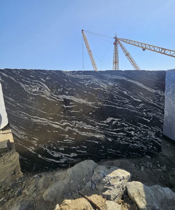 Product Overview: Reliance Titanium Black & Forest Black Granite is a luxurious natural stone celebrated for its striking black background enriched with flowing golden and white veins. Mined from our owned quarry, this granite represents strength, elegance, and timeless beauty — making it a preferred choice for high-end architectural and interior projects across the globe. Each block is a unique creation of nature, offering unmatched character and visual depth. Technical Specifications: Title Reliance Titanium Black & Forest Black Granite Block Stone Type Granite Block Type Gangsaw Block Block Size 300 CM x 180 CM x 180 CM (LXWXH) Color Deep Black with Gold & White Veins Surface Finish Options Wire Saw Cut Density 2960-3000 kg/m3 Compressive Strength 200-250 MPa Water Absorption 0.2%-0.3% Hardness (Mohs) 6 to 7 Porosity Low Origin India Applications Slabs, Countertops, Flooring, Wall Cladding, Interior Key Features: Elegant Aesthetic Appeal: Deep jet-black background enhanced by golden and silver waves — a naturally luxurious look. Superior Strength & Durability: Excellent structural integrity and long-term performance in varied climates. High Polish Retention: Achieves exceptional gloss and mirror-like reflection after finishing. Consistent Texture: Uniform color and grain suitable for large-scale architectural applications. Versatile Application Range: Perfect for multiple interior purposes. Low Maintenance: Resistant to stains, scratches, and moisture, ensuring lasting beauty with minimal upkeep. Export-Grade Blocks: Carefully selected and cut for optimal slab yield and international market standards. Recommended Uses: Kitchen Countertops & Islands Luxury Flooring & Staircases Hotel Lobbies & Reception Areas Wall Cladding & Facades Memorials & Monuments Designer Furniture Tops Why Choose Reliance Titanium Black Granite and Forest Black Granite? Our granite is preferred by export buyers because of: Natural white veins and attractive deep black surface Zero crack, high strength and durability, suitable for projects & reprocessing Consistent Gang Saw block sizes Strict quality checks for each block before shipment Reliable and stable long-term supply Export Capabilities & Payment Terms: We provide smooth, professional export handling with: Payment Options: L/C at sight (Letter of Credit at sight) D/P (Documents Against Payment) T/T advance (if preferred by the buyer) Shipping Documents Provided: Bill of Lading (BL) Commercial Invoice Packing List Certificate of Origin Other documents as per buyer requirements Shipping Price Options: FOB (Indian Port) CNF (any destination port globally) Our logistics team ensures timely loading, documentation, and shipment coordination for a hassle-free experience. About Reliance Mines & Minerals We have a strong presence in the global stone industry, regularly exporting to China, Germany, USA, Oman, and Qatar . Our team is experienced in international trade procedures, ensuring professional communication and smooth cooperation with all partners. We Welcome Your Inquiry If your company is seeking a reliable supplier for premium Titanium black & Forest black granite blocks, we would be pleased to offer quotations, block photos, videos and quarry videos and further details. We look forward to establishing a long-term and successful business relationship with your esteemed company. More About Reliance Titanium Black & Forest Black Granite: Reliance Titanium Black & Forest Black Granite combines natural elegance with engineering excellence. Its bold veins and premium polish bring sophistication to any architectural space, while its robust physical properties ensure durability even in demanding environments. Each block is meticulously extracted and inspected to meet international export quality benchmarks. Reliance Mines & Minerals specializes in the sales and global export of premium granite blocks and slabs. With years of experience in the stone industry, we have established a strong presence in international markets. We are committed to delivering top-quality granite with timely and reliable shipments to major ports worldwide. Our dedicated sales and logistics team is highly skilled in managing export documentation, container loading, and shipping procedures, ensuring a smooth and hassle-free experience for our clients. At the heart of our business is a focus on excellence, professionalism, and customer satisfaction, making us a trusted partner for granite buyers around the globe. 印度 花岗岩 块料 泰坦黑 花岗岩 印度 森林黑 花岗岩 印度 印度 花岗岩 块料, 印度 出口 花岗岩 块, 印度花岗岩原石 中国进口 India granite block Titanium Black granite India Forest Black granite India Granite Blocks Titanium Black Granite Reliance Titanium Black Granite Titanium Black Granite Slabs Polished Titanium Black Granite Bookmatch Titanium Black Granite Titanium Black Granite Exporters India Titanium Black Granite Suppliers Titanium Black Granite Manufacturers Exotic Black Granite with White Veins Deep Black Granite Slabs Mirror Polished Granite Luxury Granite for Interior Walls Natural Stone for Modern Architecture High Gloss Granite Panels Bookmatched Granite Wall Design Black Granite for Hotel Lobby & Flooring Designer Granite Slabs for Projects Indian Granite Exporters Premium Granite from India Granite Slabs for Export Worldwide Granite Supplier Natural Stone Exporter from India Wholesale Granite Supplier Black Granite for Construction & Interiors Architectural Granite Stone Supplier Custom Cut Granite Slabs Export Granite for Wall Cladding Granite for Flooring Granite for Kitchen Countertops Granite for Hotel & Commercial Projects Interior Stone Cladding Luxury Stone for Architects & Designers Black Forest Granite supplier Black Forest Granite manufacturer Black Forest Granite exporter Black Forest Granite quarry Black Forest Granite wholesaler Black Forest Granite seller Buy Black Forest Granite blocks Buy Black Forest Granite slabs Black Forest Granite for flooring Black Forest Granite for countertops Black Forest Granite for wall cladding Black Forest Granite price per sqm Black Forest Granite bulk supplier Black Forest Granite block exporter Black Forest Granite slab manufacturer Black Forest Granite quarry owner Black Forest Granite wholesale price Black Forest Granite large quantity supplier Black Forest Granite custom sizes Black Forest Granite supplier India Black Forest Granite manufacturer India Black Forest Granite exporter India Black Forest Granite quarry India Black Forest Granite supplier [Your City/State] Black Forest Granite international exporter Premium Black Forest Granite supplier Natural Black Forest Granite stone High quality Black Forest Granite slabs Black Forest Granite direct from quarry Black Forest Granite blocks for export Black Forest Granite polished slabs Black granite stone supplier Natural granite stone exporter Indian black granite manufacturer Granite blocks and slabs exporter Dimension stone granite supplier Nebula Wave Granite Stone Manufacturer Export Quality Blocks Supplier Quarry Reliance Mines India Titanium Black Granite Stone Manufacturer Export Quality Blocks Supplier Quarry Reliance Mines India Cosmic Black Granite Stone Manufacturer Export Quality Blocks Supplier Quarry Reliance Mines India Marquina Black Granite Stone Manufacturer Export Quality Blocks Supplier Quarry Reliance Mines India Black Forest Granite Stone Manufacturer Export Quality Blocks Supplier Quarry Reliance Mines India #TitaniumBlackGranite #RelianceGranite #IndianGranite #GraniteExporter #LuxuryGranite #GraniteSupplier #BlackGranite #NaturalStoneIndia #GraniteSlabs #GraniteBookmatch #InteriorDesignStone #ArchitecturalStone #PremiumGranite #GraniteExport #GraniteDesigns #reliancemines #granite #marble #stone #quarry #forestblackgranite