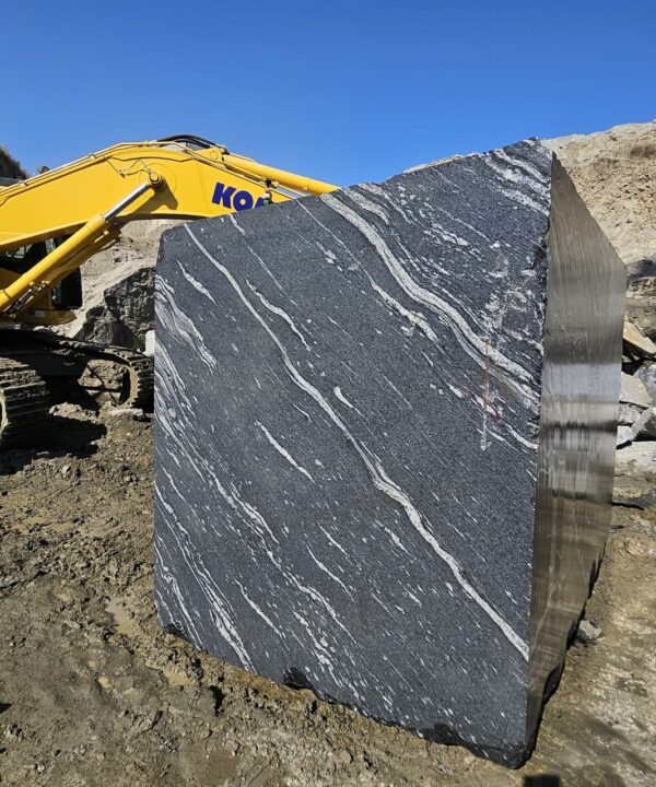 Product Overview: Reliance Titanium Black & Forest Black Granite is a luxurious natural stone celebrated for its striking black background enriched with flowing golden and white veins. Mined from our owned quarry, this granite represents strength, elegance, and timeless beauty — making it a preferred choice for high-end architectural and interior projects across the globe. Each block is a unique creation of nature, offering unmatched character and visual depth. Technical Specifications: Title Reliance Titanium Black & Forest Black Granite Block Stone Type Granite Block Type Gangsaw Block Block Size 300 CM x 180 CM x 180 CM (LXWXH) Color Deep Black with Gold & White Veins Surface Finish Options Wire Saw Cut Density 2960-3000 kg/m3 Compressive Strength 200-250 MPa Water Absorption 0.2%-0.3% Hardness (Mohs) 6 to 7 Porosity Low Origin India Applications Slabs, Countertops, Flooring, Wall Cladding, Interior Key Features: Elegant Aesthetic Appeal: Deep jet-black background enhanced by golden and silver waves — a naturally luxurious look. Superior Strength & Durability: Excellent structural integrity and long-term performance in varied climates. High Polish Retention: Achieves exceptional gloss and mirror-like reflection after finishing. Consistent Texture: Uniform color and grain suitable for large-scale architectural applications. Versatile Application Range: Perfect for multiple interior purposes. Low Maintenance: Resistant to stains, scratches, and moisture, ensuring lasting beauty with minimal upkeep. Export-Grade Blocks: Carefully selected and cut for optimal slab yield and international market standards. Recommended Uses: Kitchen Countertops & Islands Luxury Flooring & Staircases Hotel Lobbies & Reception Areas Wall Cladding & Facades Memorials & Monuments Designer Furniture Tops Why Choose Reliance Titanium Black Granite and Forest Black Granite? Our granite is preferred by export buyers because of: Natural white veins and attractive deep black surface Zero crack, high strength and durability, suitable for projects & reprocessing Consistent Gang Saw block sizes Strict quality checks for each block before shipment Reliable and stable long-term supply Export Capabilities & Payment Terms: We provide smooth, professional export handling with: Payment Options: L/C at sight (Letter of Credit at sight) D/P (Documents Against Payment) T/T advance (if preferred by the buyer) Shipping Documents Provided: Bill of Lading (BL) Commercial Invoice Packing List Certificate of Origin Other documents as per buyer requirements Shipping Price Options: FOB (Indian Port) CNF (any destination port globally) Our logistics team ensures timely loading, documentation, and shipment coordination for a hassle-free experience. About Reliance Mines & Minerals We have a strong presence in the global stone industry, regularly exporting to China, Germany, USA, Oman, and Qatar . Our team is experienced in international trade procedures, ensuring professional communication and smooth cooperation with all partners. We Welcome Your Inquiry If your company is seeking a reliable supplier for premium Titanium black & Forest black granite blocks, we would be pleased to offer quotations, block photos, videos and quarry videos and further details. We look forward to establishing a long-term and successful business relationship with your esteemed company. More About Reliance Titanium Black & Forest Black Granite: Reliance Titanium Black & Forest Black Granite combines natural elegance with engineering excellence. Its bold veins and premium polish bring sophistication to any architectural space, while its robust physical properties ensure durability even in demanding environments. Each block is meticulously extracted and inspected to meet international export quality benchmarks. Reliance Mines & Minerals specializes in the sales and global export of premium granite blocks and slabs. With years of experience in the stone industry, we have established a strong presence in international markets. We are committed to delivering top-quality granite with timely and reliable shipments to major ports worldwide. Our dedicated sales and logistics team is highly skilled in managing export documentation, container loading, and shipping procedures, ensuring a smooth and hassle-free experience for our clients. At the heart of our business is a focus on excellence, professionalism, and customer satisfaction, making us a trusted partner for granite buyers around the globe. 印度 花岗岩 块料 泰坦黑 花岗岩 印度 森林黑 花岗岩 印度 印度 花岗岩 块料, 印度 出口 花岗岩 块, 印度花岗岩原石 中国进口 India granite block Titanium Black granite India Forest Black granite India Granite Blocks Titanium Black Granite Reliance Titanium Black Granite Titanium Black Granite Slabs Polished Titanium Black Granite Bookmatch Titanium Black Granite Titanium Black Granite Exporters India Titanium Black Granite Suppliers Titanium Black Granite Manufacturers Exotic Black Granite with White Veins Deep Black Granite Slabs Mirror Polished Granite Luxury Granite for Interior Walls Natural Stone for Modern Architecture High Gloss Granite Panels Bookmatched Granite Wall Design Black Granite for Hotel Lobby & Flooring Designer Granite Slabs for Projects Indian Granite Exporters Premium Granite from India Granite Slabs for Export Worldwide Granite Supplier Natural Stone Exporter from India Wholesale Granite Supplier Black Granite for Construction & Interiors Architectural Granite Stone Supplier Custom Cut Granite Slabs Export Granite for Wall Cladding Granite for Flooring Granite for Kitchen Countertops Granite for Hotel & Commercial Projects Interior Stone Cladding Luxury Stone for Architects & Designers Black Forest Granite supplier Black Forest Granite manufacturer Black Forest Granite exporter Black Forest Granite quarry Black Forest Granite wholesaler Black Forest Granite seller Buy Black Forest Granite blocks Buy Black Forest Granite slabs Black Forest Granite for flooring Black Forest Granite for countertops Black Forest Granite for wall cladding Black Forest Granite price per sqm Black Forest Granite bulk supplier Black Forest Granite block exporter Black Forest Granite slab manufacturer Black Forest Granite quarry owner Black Forest Granite wholesale price Black Forest Granite large quantity supplier Black Forest Granite custom sizes Black Forest Granite supplier India Black Forest Granite manufacturer India Black Forest Granite exporter India Black Forest Granite quarry India Black Forest Granite supplier [Your City/State] Black Forest Granite international exporter Premium Black Forest Granite supplier Natural Black Forest Granite stone High quality Black Forest Granite slabs Black Forest Granite direct from quarry Black Forest Granite blocks for export Black Forest Granite polished slabs Black granite stone supplier Natural granite stone exporter Indian black granite manufacturer Granite blocks and slabs exporter Dimension stone granite supplier Nebula Wave Granite Stone Manufacturer Export Quality Blocks Supplier Quarry Reliance Mines India Titanium Black Granite Stone Manufacturer Export Quality Blocks Supplier Quarry Reliance Mines India Cosmic Black Granite Stone Manufacturer Export Quality Blocks Supplier Quarry Reliance Mines India Marquina Black Granite Stone Manufacturer Export Quality Blocks Supplier Quarry Reliance Mines India Black Forest Granite Stone Manufacturer Export Quality Blocks Supplier Quarry Reliance Mines India #TitaniumBlackGranite #RelianceGranite #IndianGranite #GraniteExporter #LuxuryGranite #GraniteSupplier #BlackGranite #NaturalStoneIndia #GraniteSlabs #GraniteBookmatch #InteriorDesignStone #ArchitecturalStone #PremiumGranite #GraniteExport #GraniteDesigns #reliancemines #granite #marble #stone #quarry #forestblackgranite