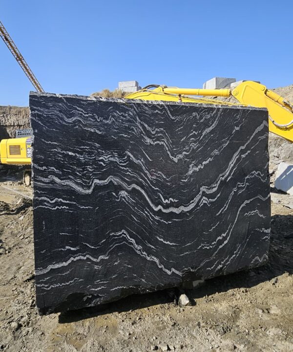 Product Overview: Reliance Titanium Black & Forest Black Granite is a luxurious natural stone celebrated for its striking black background enriched with flowing golden and white veins. Mined from our owned quarry, this granite represents strength, elegance, and timeless beauty — making it a preferred choice for high-end architectural and interior projects across the globe. Each block is a unique creation of nature, offering unmatched character and visual depth. Technical Specifications: Title Reliance Titanium Black & Forest Black Granite Block Stone Type Granite Block Type Gangsaw Block Block Size 300 CM x 180 CM x 180 CM (LXWXH) Color Deep Black with Gold & White Veins Surface Finish Options Wire Saw Cut Density 2960-3000 kg/m3 Compressive Strength 200-250 MPa Water Absorption 0.2%-0.3% Hardness (Mohs) 6 to 7 Porosity Low Origin India Applications Slabs, Countertops, Flooring, Wall Cladding, Interior Key Features: Elegant Aesthetic Appeal: Deep jet-black background enhanced by golden and silver waves — a naturally luxurious look. Superior Strength & Durability: Excellent structural integrity and long-term performance in varied climates. High Polish Retention: Achieves exceptional gloss and mirror-like reflection after finishing. Consistent Texture: Uniform color and grain suitable for large-scale architectural applications. Versatile Application Range: Perfect for multiple interior purposes. Low Maintenance: Resistant to stains, scratches, and moisture, ensuring lasting beauty with minimal upkeep. Export-Grade Blocks: Carefully selected and cut for optimal slab yield and international market standards. Recommended Uses: Kitchen Countertops & Islands Luxury Flooring & Staircases Hotel Lobbies & Reception Areas Wall Cladding & Facades Memorials & Monuments Designer Furniture Tops Why Choose Reliance Titanium Black Granite and Forest Black Granite? Our granite is preferred by export buyers because of: Natural white veins and attractive deep black surface Zero crack, high strength and durability, suitable for projects & reprocessing Consistent Gang Saw block sizes Strict quality checks for each block before shipment Reliable and stable long-term supply Export Capabilities & Payment Terms: We provide smooth, professional export handling with: Payment Options: L/C at sight (Letter of Credit at sight) D/P (Documents Against Payment) T/T advance (if preferred by the buyer) Shipping Documents Provided: Bill of Lading (BL) Commercial Invoice Packing List Certificate of Origin Other documents as per buyer requirements Shipping Price Options: FOB (Indian Port) CNF (any destination port globally) Our logistics team ensures timely loading, documentation, and shipment coordination for a hassle-free experience. About Reliance Mines & Minerals We have a strong presence in the global stone industry, regularly exporting to China, Germany, USA, Oman, and Qatar . Our team is experienced in international trade procedures, ensuring professional communication and smooth cooperation with all partners. We Welcome Your Inquiry If your company is seeking a reliable supplier for premium Titanium black & Forest black granite blocks, we would be pleased to offer quotations, block photos, videos and quarry videos and further details. We look forward to establishing a long-term and successful business relationship with your esteemed company. More About Reliance Titanium Black & Forest Black Granite: Reliance Titanium Black & Forest Black Granite combines natural elegance with engineering excellence. Its bold veins and premium polish bring sophistication to any architectural space, while its robust physical properties ensure durability even in demanding environments. Each block is meticulously extracted and inspected to meet international export quality benchmarks. Reliance Mines & Minerals specializes in the sales and global export of premium granite blocks and slabs. With years of experience in the stone industry, we have established a strong presence in international markets. We are committed to delivering top-quality granite with timely and reliable shipments to major ports worldwide. Our dedicated sales and logistics team is highly skilled in managing export documentation, container loading, and shipping procedures, ensuring a smooth and hassle-free experience for our clients. At the heart of our business is a focus on excellence, professionalism, and customer satisfaction, making us a trusted partner for granite buyers around the globe. 印度 花岗岩 块料 泰坦黑 花岗岩 印度 森林黑 花岗岩 印度 印度 花岗岩 块料, 印度 出口 花岗岩 块, 印度花岗岩原石 中国进口 India granite block Titanium Black granite India Forest Black granite India Granite Blocks Titanium Black Granite Reliance Titanium Black Granite Titanium Black Granite Slabs Polished Titanium Black Granite Bookmatch Titanium Black Granite Titanium Black Granite Exporters India Titanium Black Granite Suppliers Titanium Black Granite Manufacturers Exotic Black Granite with White Veins Deep Black Granite Slabs Mirror Polished Granite Luxury Granite for Interior Walls Natural Stone for Modern Architecture High Gloss Granite Panels Bookmatched Granite Wall Design Black Granite for Hotel Lobby & Flooring Designer Granite Slabs for Projects Indian Granite Exporters Premium Granite from India Granite Slabs for Export Worldwide Granite Supplier Natural Stone Exporter from India Wholesale Granite Supplier Black Granite for Construction & Interiors Architectural Granite Stone Supplier Custom Cut Granite Slabs Export Granite for Wall Cladding Granite for Flooring Granite for Kitchen Countertops Granite for Hotel & Commercial Projects Interior Stone Cladding Luxury Stone for Architects & Designers Black Forest Granite supplier Black Forest Granite manufacturer Black Forest Granite exporter Black Forest Granite quarry Black Forest Granite wholesaler Black Forest Granite seller Buy Black Forest Granite blocks Buy Black Forest Granite slabs Black Forest Granite for flooring Black Forest Granite for countertops Black Forest Granite for wall cladding Black Forest Granite price per sqm Black Forest Granite bulk supplier Black Forest Granite block exporter Black Forest Granite slab manufacturer Black Forest Granite quarry owner Black Forest Granite wholesale price Black Forest Granite large quantity supplier Black Forest Granite custom sizes Black Forest Granite supplier India Black Forest Granite manufacturer India Black Forest Granite exporter India Black Forest Granite quarry India Black Forest Granite supplier [Your City/State] Black Forest Granite international exporter Premium Black Forest Granite supplier Natural Black Forest Granite stone High quality Black Forest Granite slabs Black Forest Granite direct from quarry Black Forest Granite blocks for export Black Forest Granite polished slabs Black granite stone supplier Natural granite stone exporter Indian black granite manufacturer Granite blocks and slabs exporter Dimension stone granite supplier Nebula Wave Granite Stone Manufacturer Export Quality Blocks Supplier Quarry Reliance Mines India Titanium Black Granite Stone Manufacturer Export Quality Blocks Supplier Quarry Reliance Mines India Cosmic Black Granite Stone Manufacturer Export Quality Blocks Supplier Quarry Reliance Mines India Marquina Black Granite Stone Manufacturer Export Quality Blocks Supplier Quarry Reliance Mines India Black Forest Granite Stone Manufacturer Export Quality Blocks Supplier Quarry Reliance Mines India #TitaniumBlackGranite #RelianceGranite #IndianGranite #GraniteExporter #LuxuryGranite #GraniteSupplier #BlackGranite #NaturalStoneIndia #GraniteSlabs #GraniteBookmatch #InteriorDesignStone #ArchitecturalStone #PremiumGranite #GraniteExport #GraniteDesigns #reliancemines #granite #marble #stone #quarry #forestblackgranite