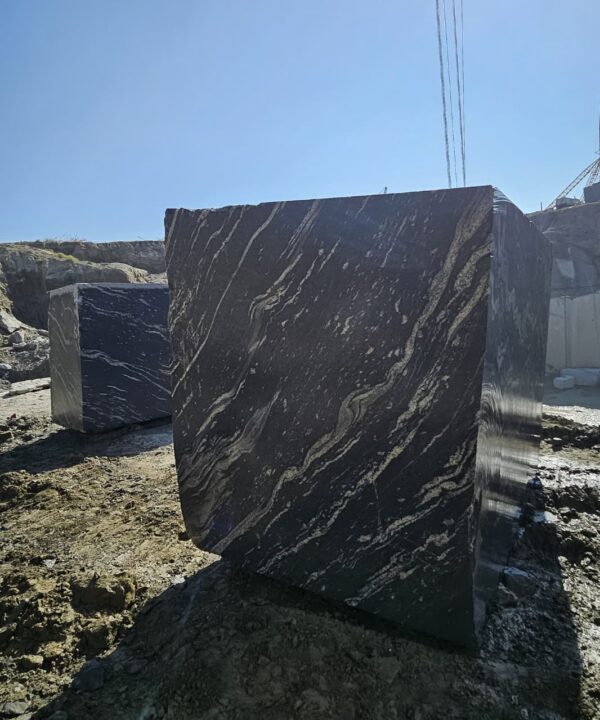 Product Overview: Reliance Titanium Black & Forest Black Granite is a luxurious natural stone celebrated for its striking black background enriched with flowing golden and white veins. Mined from our owned quarry, this granite represents strength, elegance, and timeless beauty — making it a preferred choice for high-end architectural and interior projects across the globe. Each block is a unique creation of nature, offering unmatched character and visual depth. Technical Specifications: Title Reliance Titanium Black & Forest Black Granite Block Stone Type Granite Block Type Gangsaw Block Block Size 300 CM x 180 CM x 180 CM (LXWXH) Color Deep Black with Gold & White Veins Surface Finish Options Wire Saw Cut Density 2960-3000 kg/m3 Compressive Strength 200-250 MPa Water Absorption 0.2%-0.3% Hardness (Mohs) 6 to 7 Porosity Low Origin India Applications Slabs, Countertops, Flooring, Wall Cladding, Interior Key Features: Elegant Aesthetic Appeal: Deep jet-black background enhanced by golden and silver waves — a naturally luxurious look. Superior Strength & Durability: Excellent structural integrity and long-term performance in varied climates. High Polish Retention: Achieves exceptional gloss and mirror-like reflection after finishing. Consistent Texture: Uniform color and grain suitable for large-scale architectural applications. Versatile Application Range: Perfect for multiple interior purposes. Low Maintenance: Resistant to stains, scratches, and moisture, ensuring lasting beauty with minimal upkeep. Export-Grade Blocks: Carefully selected and cut for optimal slab yield and international market standards. Recommended Uses: Kitchen Countertops & Islands Luxury Flooring & Staircases Hotel Lobbies & Reception Areas Wall Cladding & Facades Memorials & Monuments Designer Furniture Tops Why Choose Reliance Titanium Black Granite and Forest Black Granite? Our granite is preferred by export buyers because of: Natural white veins and attractive deep black surface Zero crack, high strength and durability, suitable for projects & reprocessing Consistent Gang Saw block sizes Strict quality checks for each block before shipment Reliable and stable long-term supply Export Capabilities & Payment Terms: We provide smooth, professional export handling with: Payment Options: L/C at sight (Letter of Credit at sight) D/P (Documents Against Payment) T/T advance (if preferred by the buyer) Shipping Documents Provided: Bill of Lading (BL) Commercial Invoice Packing List Certificate of Origin Other documents as per buyer requirements Shipping Price Options: FOB (Indian Port) CNF (any destination port globally) Our logistics team ensures timely loading, documentation, and shipment coordination for a hassle-free experience. About Reliance Mines & Minerals We have a strong presence in the global stone industry, regularly exporting to China, Germany, USA, Oman, and Qatar . Our team is experienced in international trade procedures, ensuring professional communication and smooth cooperation with all partners. We Welcome Your Inquiry If your company is seeking a reliable supplier for premium Titanium black & Forest black granite blocks, we would be pleased to offer quotations, block photos, videos and quarry videos and further details. We look forward to establishing a long-term and successful business relationship with your esteemed company. More About Reliance Titanium Black & Forest Black Granite: Reliance Titanium Black & Forest Black Granite combines natural elegance with engineering excellence. Its bold veins and premium polish bring sophistication to any architectural space, while its robust physical properties ensure durability even in demanding environments. Each block is meticulously extracted and inspected to meet international export quality benchmarks. Reliance Mines & Minerals specializes in the sales and global export of premium granite blocks and slabs. With years of experience in the stone industry, we have established a strong presence in international markets. We are committed to delivering top-quality granite with timely and reliable shipments to major ports worldwide. Our dedicated sales and logistics team is highly skilled in managing export documentation, container loading, and shipping procedures, ensuring a smooth and hassle-free experience for our clients. At the heart of our business is a focus on excellence, professionalism, and customer satisfaction, making us a trusted partner for granite buyers around the globe. 印度 花岗岩 块料 泰坦黑 花岗岩 印度 森林黑 花岗岩 印度 印度 花岗岩 块料, 印度 出口 花岗岩 块, 印度花岗岩原石 中国进口 India granite block Titanium Black granite India Forest Black granite India Granite Blocks Titanium Black Granite Reliance Titanium Black Granite Titanium Black Granite Slabs Polished Titanium Black Granite Bookmatch Titanium Black Granite Titanium Black Granite Exporters India Titanium Black Granite Suppliers Titanium Black Granite Manufacturers Exotic Black Granite with White Veins Deep Black Granite Slabs Mirror Polished Granite Luxury Granite for Interior Walls Natural Stone for Modern Architecture High Gloss Granite Panels Bookmatched Granite Wall Design Black Granite for Hotel Lobby & Flooring Designer Granite Slabs for Projects Indian Granite Exporters Premium Granite from India Granite Slabs for Export Worldwide Granite Supplier Natural Stone Exporter from India Wholesale Granite Supplier Black Granite for Construction & Interiors Architectural Granite Stone Supplier Custom Cut Granite Slabs Export Granite for Wall Cladding Granite for Flooring Granite for Kitchen Countertops Granite for Hotel & Commercial Projects Interior Stone Cladding Luxury Stone for Architects & Designers Black Forest Granite supplier Black Forest Granite manufacturer Black Forest Granite exporter Black Forest Granite quarry Black Forest Granite wholesaler Black Forest Granite seller Buy Black Forest Granite blocks Buy Black Forest Granite slabs Black Forest Granite for flooring Black Forest Granite for countertops Black Forest Granite for wall cladding Black Forest Granite price per sqm Black Forest Granite bulk supplier Black Forest Granite block exporter Black Forest Granite slab manufacturer Black Forest Granite quarry owner Black Forest Granite wholesale price Black Forest Granite large quantity supplier Black Forest Granite custom sizes Black Forest Granite supplier India Black Forest Granite manufacturer India Black Forest Granite exporter India Black Forest Granite quarry India Black Forest Granite supplier [Your City/State] Black Forest Granite international exporter Premium Black Forest Granite supplier Natural Black Forest Granite stone High quality Black Forest Granite slabs Black Forest Granite direct from quarry Black Forest Granite blocks for export Black Forest Granite polished slabs Black granite stone supplier Natural granite stone exporter Indian black granite manufacturer Granite blocks and slabs exporter Dimension stone granite supplier Nebula Wave Granite Stone Manufacturer Export Quality Blocks Supplier Quarry Reliance Mines India Titanium Black Granite Stone Manufacturer Export Quality Blocks Supplier Quarry Reliance Mines India Cosmic Black Granite Stone Manufacturer Export Quality Blocks Supplier Quarry Reliance Mines India Marquina Black Granite Stone Manufacturer Export Quality Blocks Supplier Quarry Reliance Mines India Black Forest Granite Stone Manufacturer Export Quality Blocks Supplier Quarry Reliance Mines India #TitaniumBlackGranite #RelianceGranite #IndianGranite #GraniteExporter #LuxuryGranite #GraniteSupplier #BlackGranite #NaturalStoneIndia #GraniteSlabs #GraniteBookmatch #InteriorDesignStone #ArchitecturalStone #PremiumGranite #GraniteExport #GraniteDesigns #reliancemines #granite #marble #stone #quarry #forestblackgranite