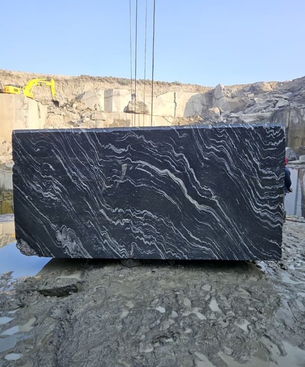 Product Overview: Reliance Titanium Black & Forest Black Granite is a luxurious natural stone celebrated for its striking black background enriched with flowing golden and white veins. Mined from our owned quarry, this granite represents strength, elegance, and timeless beauty — making it a preferred choice for high-end architectural and interior projects across the globe. Each block is a unique creation of nature, offering unmatched character and visual depth. Technical Specifications: Title Reliance Titanium Black & Forest Black Granite Block Stone Type Granite Block Type Gangsaw Block Block Size 300 CM x 180 CM x 180 CM (LXWXH) Color Deep Black with Gold & White Veins Surface Finish Options Wire Saw Cut Density 2960-3000 kg/m3 Compressive Strength 200-250 MPa Water Absorption 0.2%-0.3% Hardness (Mohs) 6 to 7 Porosity Low Origin India Applications Slabs, Countertops, Flooring, Wall Cladding, Interior Key Features: Elegant Aesthetic Appeal: Deep jet-black background enhanced by golden and silver waves — a naturally luxurious look. Superior Strength & Durability: Excellent structural integrity and long-term performance in varied climates. High Polish Retention: Achieves exceptional gloss and mirror-like reflection after finishing. Consistent Texture: Uniform color and grain suitable for large-scale architectural applications. Versatile Application Range: Perfect for multiple interior purposes. Low Maintenance: Resistant to stains, scratches, and moisture, ensuring lasting beauty with minimal upkeep. Export-Grade Blocks: Carefully selected and cut for optimal slab yield and international market standards. Recommended Uses: Kitchen Countertops & Islands Luxury Flooring & Staircases Hotel Lobbies & Reception Areas Wall Cladding & Facades Memorials & Monuments Designer Furniture Tops Why Choose Reliance Titanium Black Granite and Forest Black Granite? Our granite is preferred by export buyers because of: Natural white veins and attractive deep black surface Zero crack, high strength and durability, suitable for projects & reprocessing Consistent Gang Saw block sizes Strict quality checks for each block before shipment Reliable and stable long-term supply Export Capabilities & Payment Terms: We provide smooth, professional export handling with: Payment Options: L/C at sight (Letter of Credit at sight) D/P (Documents Against Payment) T/T advance (if preferred by the buyer) Shipping Documents Provided: Bill of Lading (BL) Commercial Invoice Packing List Certificate of Origin Other documents as per buyer requirements Shipping Price Options: FOB (Indian Port) CNF (any destination port globally) Our logistics team ensures timely loading, documentation, and shipment coordination for a hassle-free experience. About Reliance Mines & Minerals We have a strong presence in the global stone industry, regularly exporting to China, Germany, USA, Oman, and Qatar . Our team is experienced in international trade procedures, ensuring professional communication and smooth cooperation with all partners. We Welcome Your Inquiry If your company is seeking a reliable supplier for premium Titanium black & Forest black granite blocks, we would be pleased to offer quotations, block photos, videos and quarry videos and further details. We look forward to establishing a long-term and successful business relationship with your esteemed company. More About Reliance Titanium Black & Forest Black Granite: Reliance Titanium Black & Forest Black Granite combines natural elegance with engineering excellence. Its bold veins and premium polish bring sophistication to any architectural space, while its robust physical properties ensure durability even in demanding environments. Each block is meticulously extracted and inspected to meet international export quality benchmarks. Reliance Mines & Minerals specializes in the sales and global export of premium granite blocks and slabs. With years of experience in the stone industry, we have established a strong presence in international markets. We are committed to delivering top-quality granite with timely and reliable shipments to major ports worldwide. Our dedicated sales and logistics team is highly skilled in managing export documentation, container loading, and shipping procedures, ensuring a smooth and hassle-free experience for our clients. At the heart of our business is a focus on excellence, professionalism, and customer satisfaction, making us a trusted partner for granite buyers around the globe. 印度 花岗岩 块料 泰坦黑 花岗岩 印度 森林黑 花岗岩 印度 印度 花岗岩 块料, 印度 出口 花岗岩 块, 印度花岗岩原石 中国进口 India granite block Titanium Black granite India Forest Black granite India Granite Blocks Titanium Black Granite Reliance Titanium Black Granite Titanium Black Granite Slabs Polished Titanium Black Granite Bookmatch Titanium Black Granite Titanium Black Granite Exporters India Titanium Black Granite Suppliers Titanium Black Granite Manufacturers Exotic Black Granite with White Veins Deep Black Granite Slabs Mirror Polished Granite Luxury Granite for Interior Walls Natural Stone for Modern Architecture High Gloss Granite Panels Bookmatched Granite Wall Design Black Granite for Hotel Lobby & Flooring Designer Granite Slabs for Projects Indian Granite Exporters Premium Granite from India Granite Slabs for Export Worldwide Granite Supplier Natural Stone Exporter from India Wholesale Granite Supplier Black Granite for Construction & Interiors Architectural Granite Stone Supplier Custom Cut Granite Slabs Export Granite for Wall Cladding Granite for Flooring Granite for Kitchen Countertops Granite for Hotel & Commercial Projects Interior Stone Cladding Luxury Stone for Architects & Designers Black Forest Granite supplier Black Forest Granite manufacturer Black Forest Granite exporter Black Forest Granite quarry Black Forest Granite wholesaler Black Forest Granite seller Buy Black Forest Granite blocks Buy Black Forest Granite slabs Black Forest Granite for flooring Black Forest Granite for countertops Black Forest Granite for wall cladding Black Forest Granite price per sqm Black Forest Granite bulk supplier Black Forest Granite block exporter Black Forest Granite slab manufacturer Black Forest Granite quarry owner Black Forest Granite wholesale price Black Forest Granite large quantity supplier Black Forest Granite custom sizes Black Forest Granite supplier India Black Forest Granite manufacturer India Black Forest Granite exporter India Black Forest Granite quarry India Black Forest Granite supplier [Your City/State] Black Forest Granite international exporter Premium Black Forest Granite supplier Natural Black Forest Granite stone High quality Black Forest Granite slabs Black Forest Granite direct from quarry Black Forest Granite blocks for export Black Forest Granite polished slabs Black granite stone supplier Natural granite stone exporter Indian black granite manufacturer Granite blocks and slabs exporter Dimension stone granite supplier Nebula Wave Granite Stone Manufacturer Export Quality Blocks Supplier Quarry Reliance Mines India Titanium Black Granite Stone Manufacturer Export Quality Blocks Supplier Quarry Reliance Mines India Cosmic Black Granite Stone Manufacturer Export Quality Blocks Supplier Quarry Reliance Mines India Marquina Black Granite Stone Manufacturer Export Quality Blocks Supplier Quarry Reliance Mines India Black Forest Granite Stone Manufacturer Export Quality Blocks Supplier Quarry Reliance Mines India #TitaniumBlackGranite #RelianceGranite #IndianGranite #GraniteExporter #LuxuryGranite #GraniteSupplier #BlackGranite #NaturalStoneIndia #GraniteSlabs #GraniteBookmatch #InteriorDesignStone #ArchitecturalStone #PremiumGranite #GraniteExport #GraniteDesigns #reliancemines #granite #marble #stone #quarry #forestblackgranite