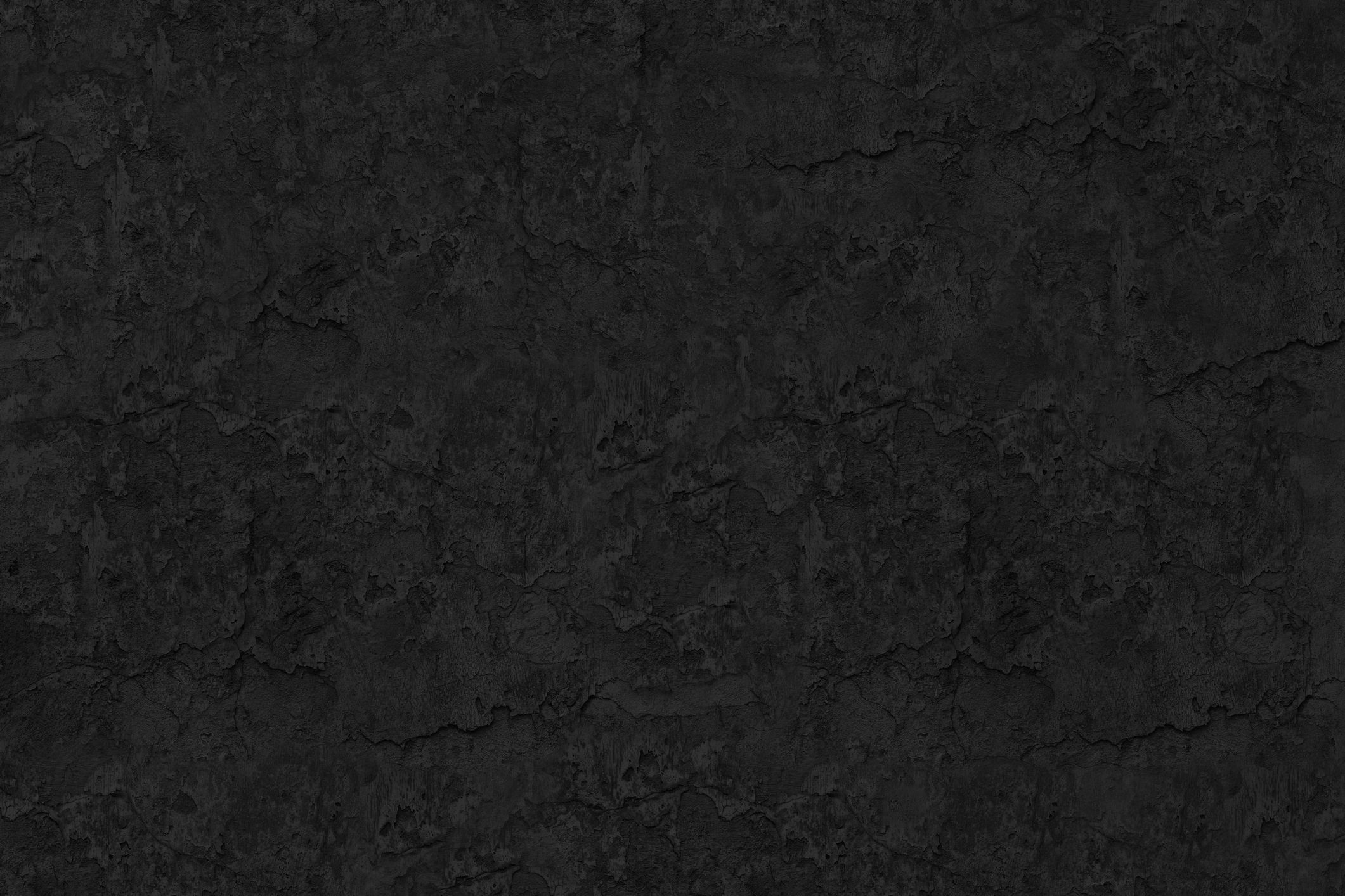 Dark textured surface evoking polished black granite