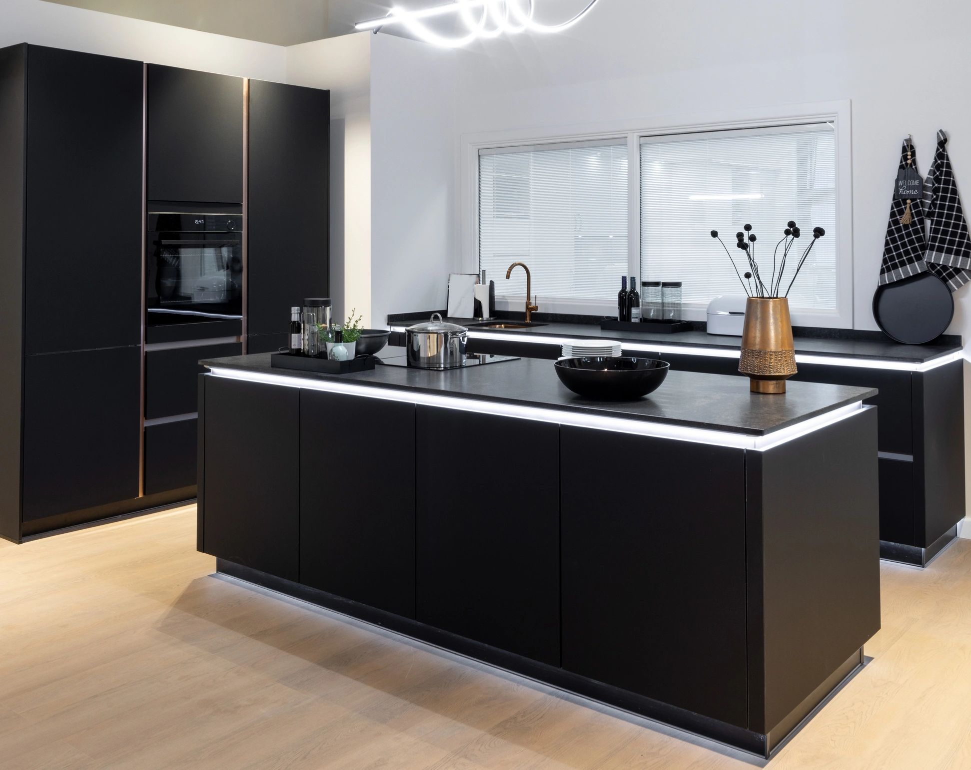 Modern dark kitchen showing premium black stone application