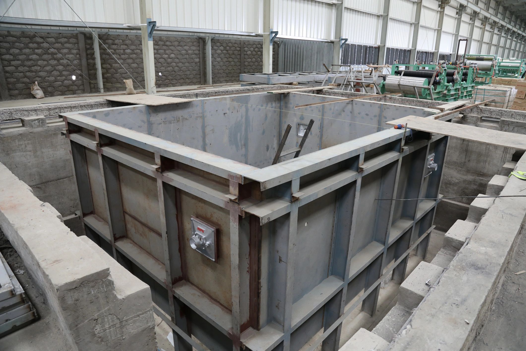 Heavy industrial machinery installation in warehouse